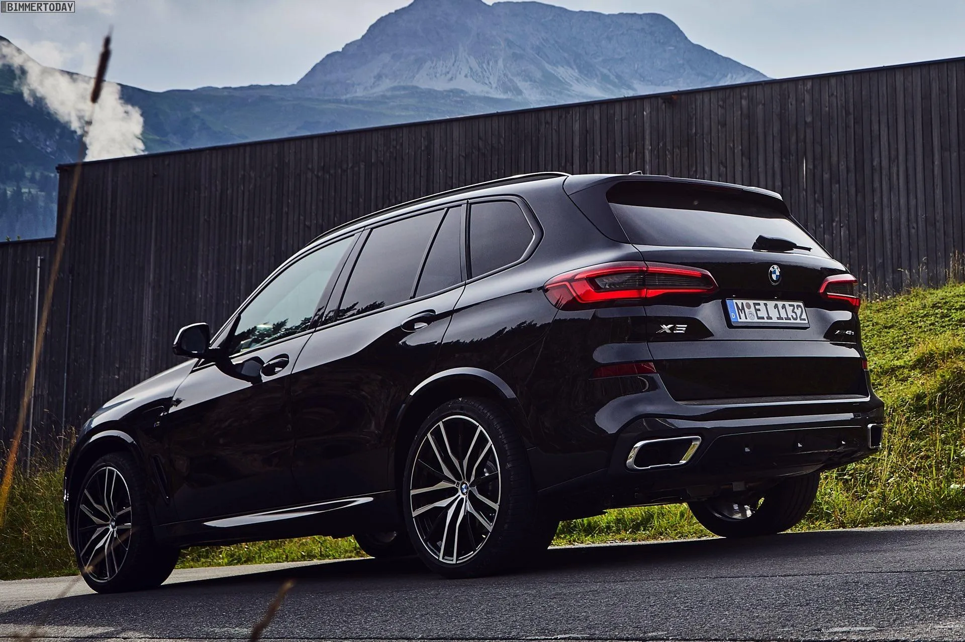 Black Bmw Suv Parked in Mountain Area During Sunny Day