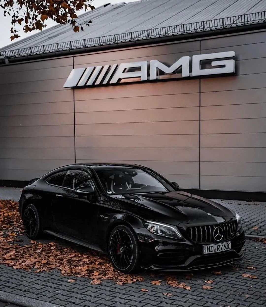 Black Mercedes AMG Sedan Outside Branded AMG Dealership