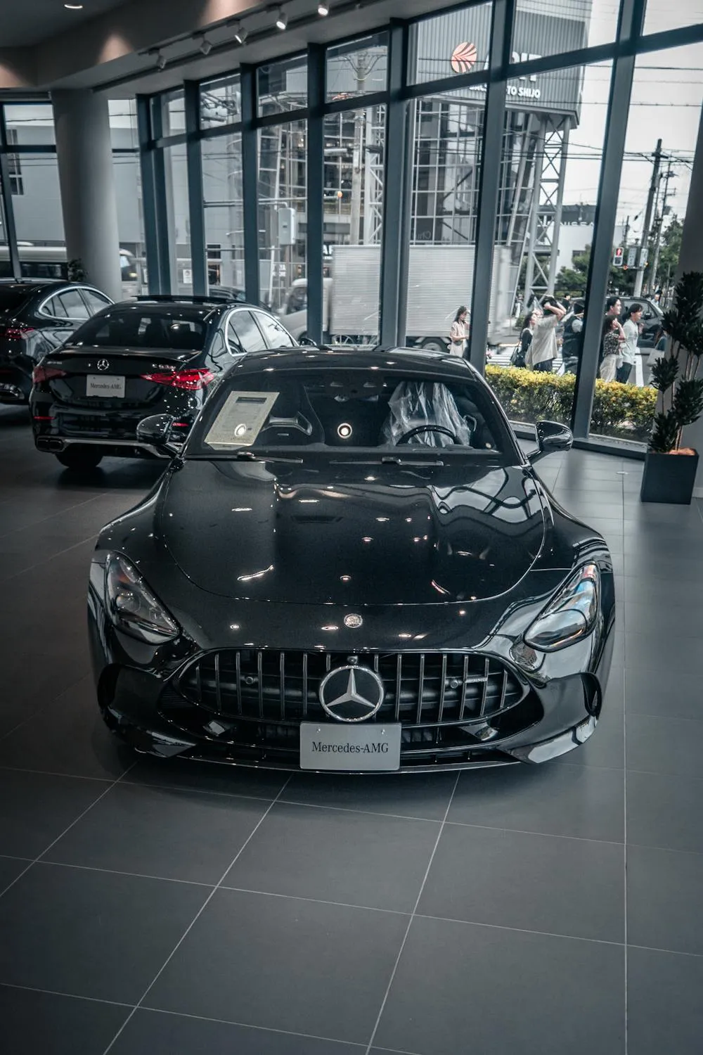 Black Mercedes AMG Showcased Inside Dealership Floor
