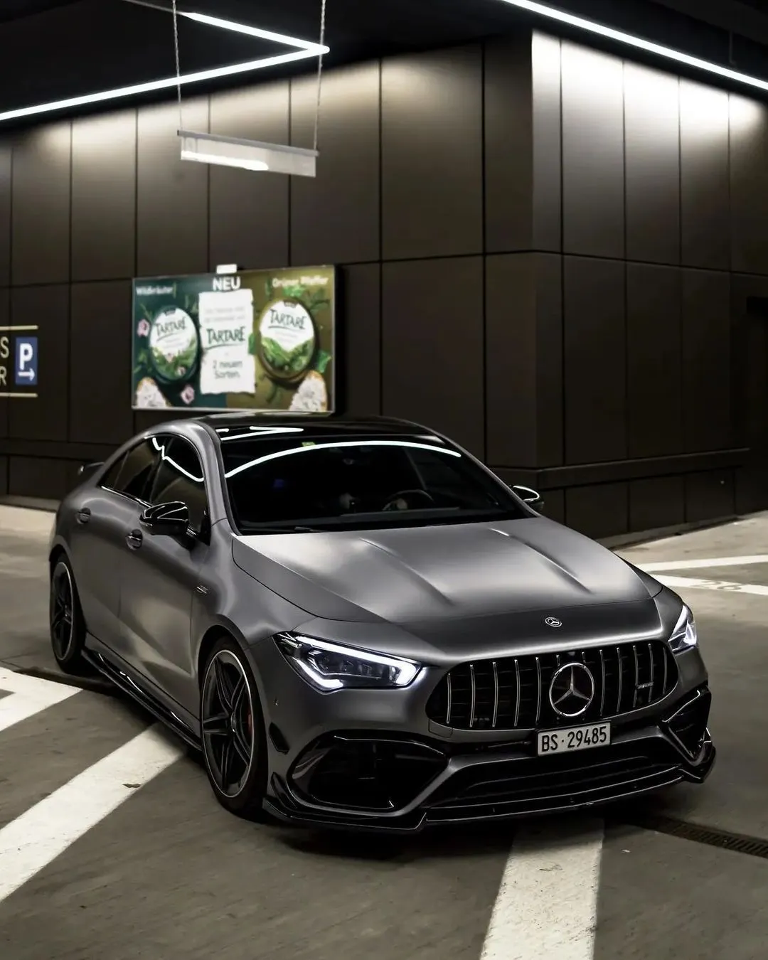 Black Mercedes Benz AMG Under Street Lights at Night