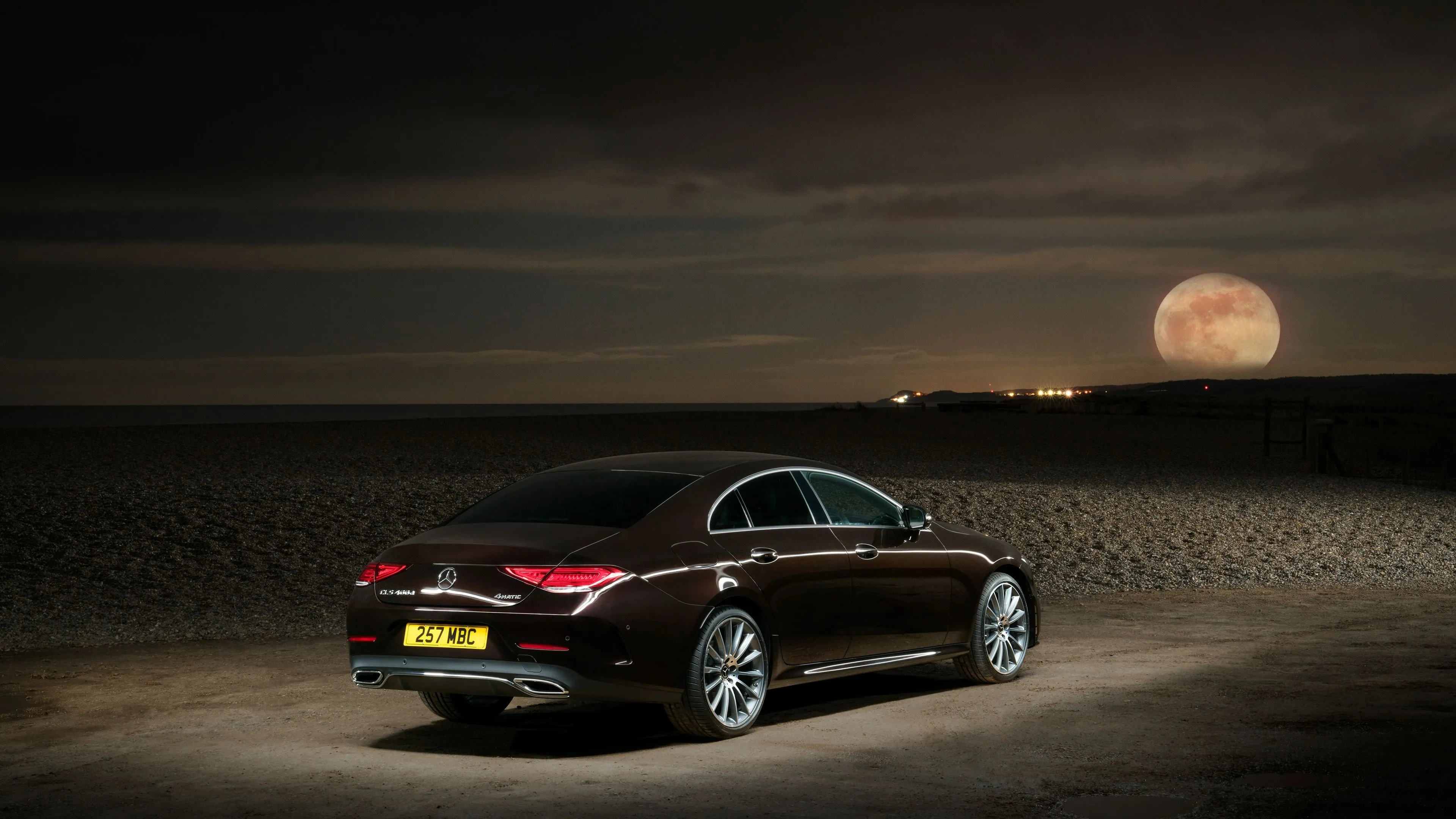 Black Mercedes Benz Car Driving Under Moonlight Wallpaper