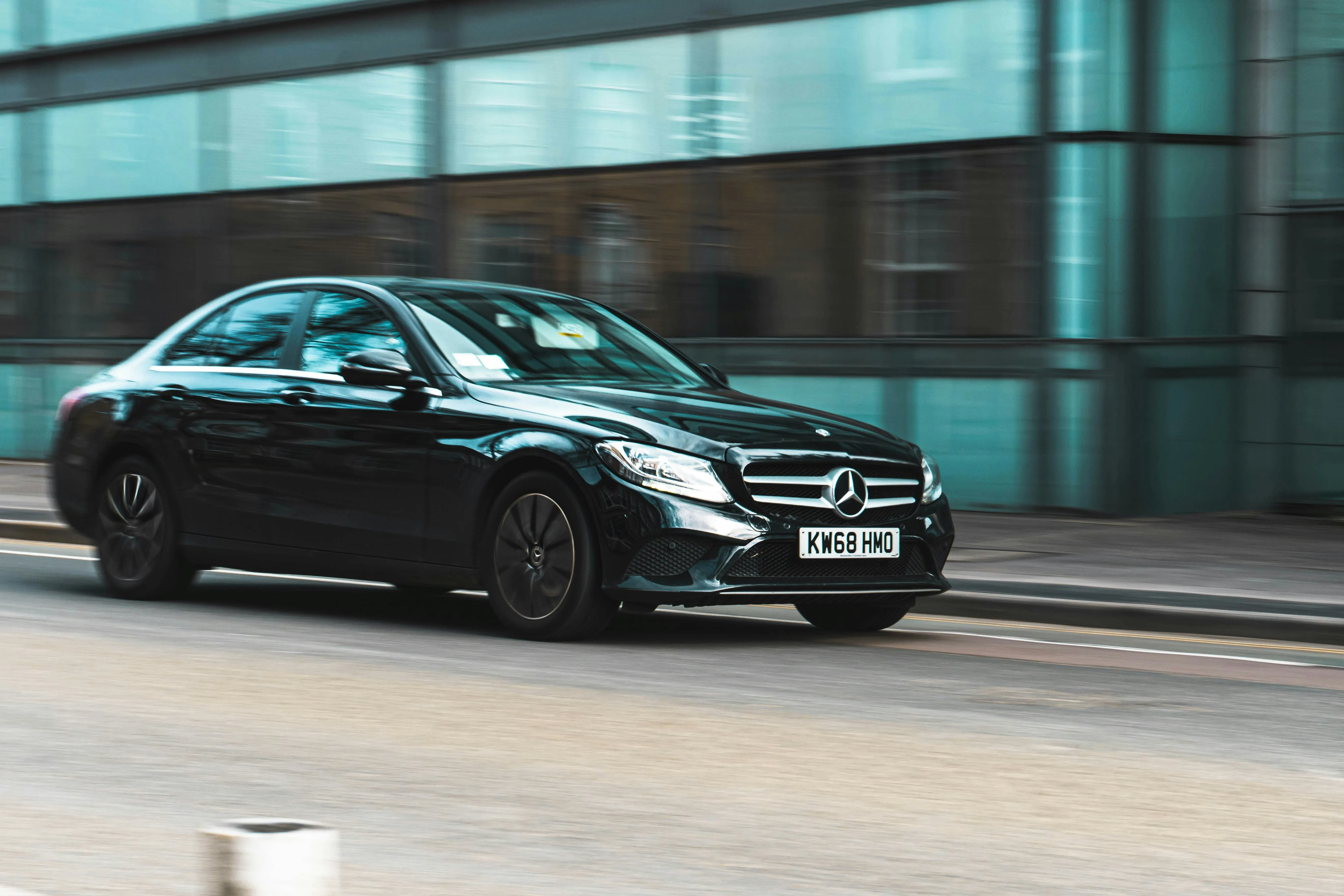 Black Mercedes Benz Car Moving Fast in Urban Area Wallpaper
