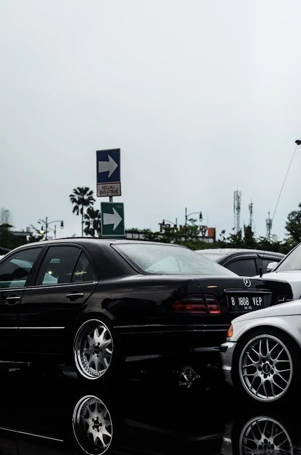 Black Mercedes Benz Cars Parked in Parking Lot free image