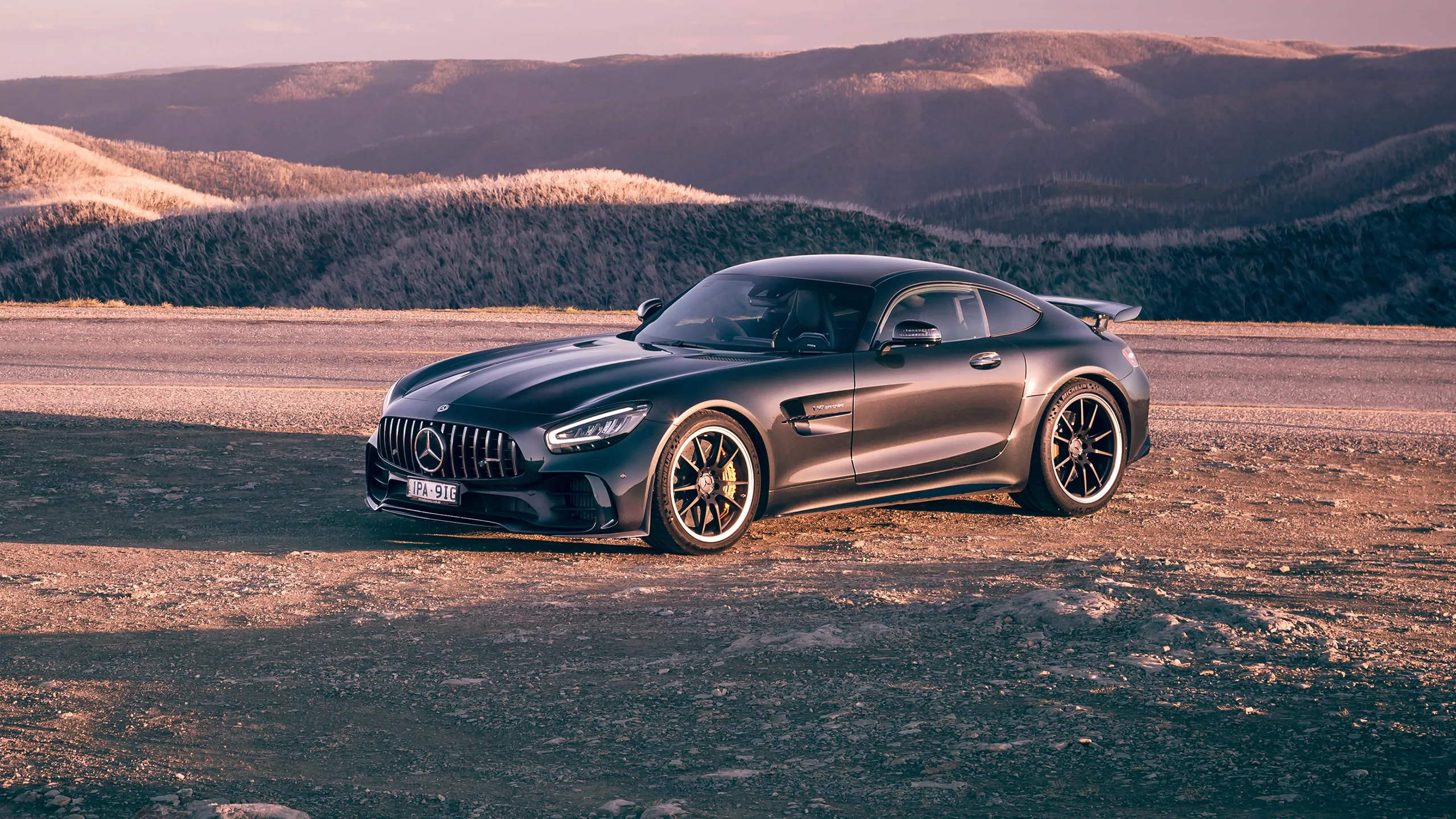 Black Mercedes Benz Coupe in Desert Landscape Sunset