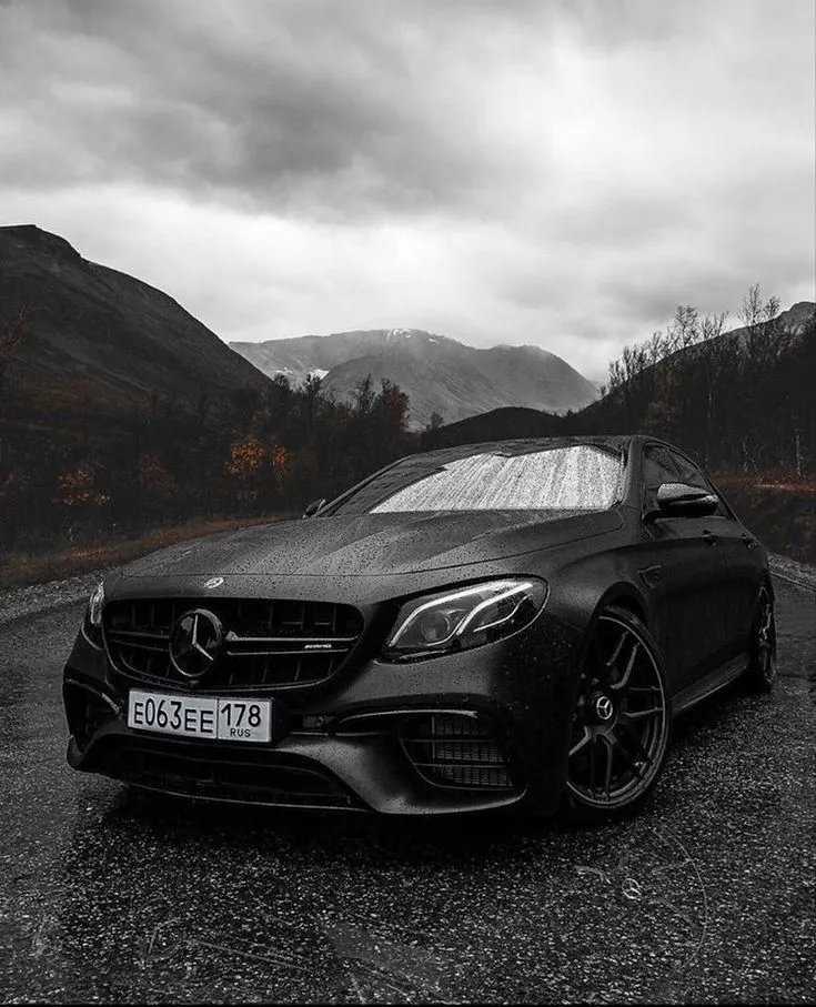 Black Mercedes Benz Coupe on Mountain Road in Monochrome