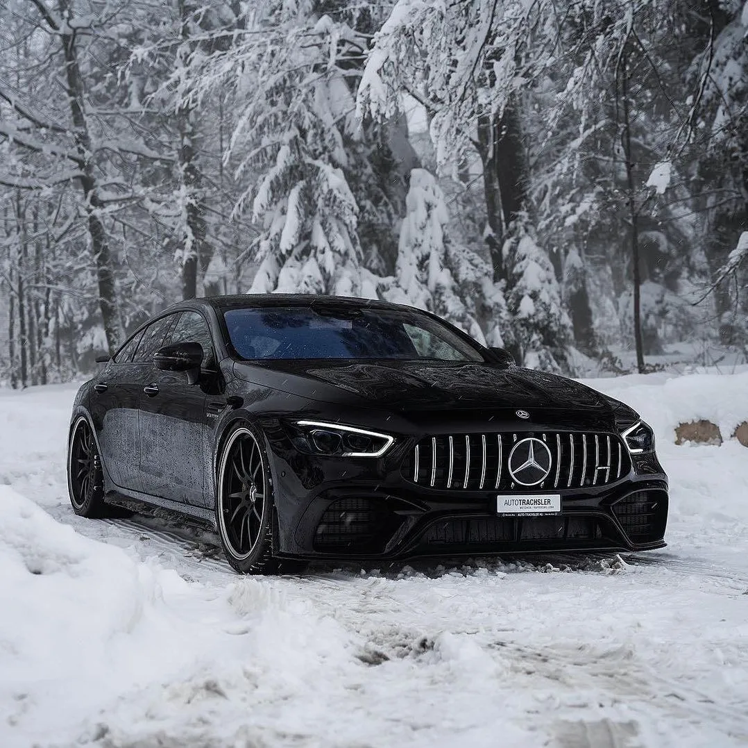 Black Mercedes Benz Driving in Snow Covered Road Wallpaper