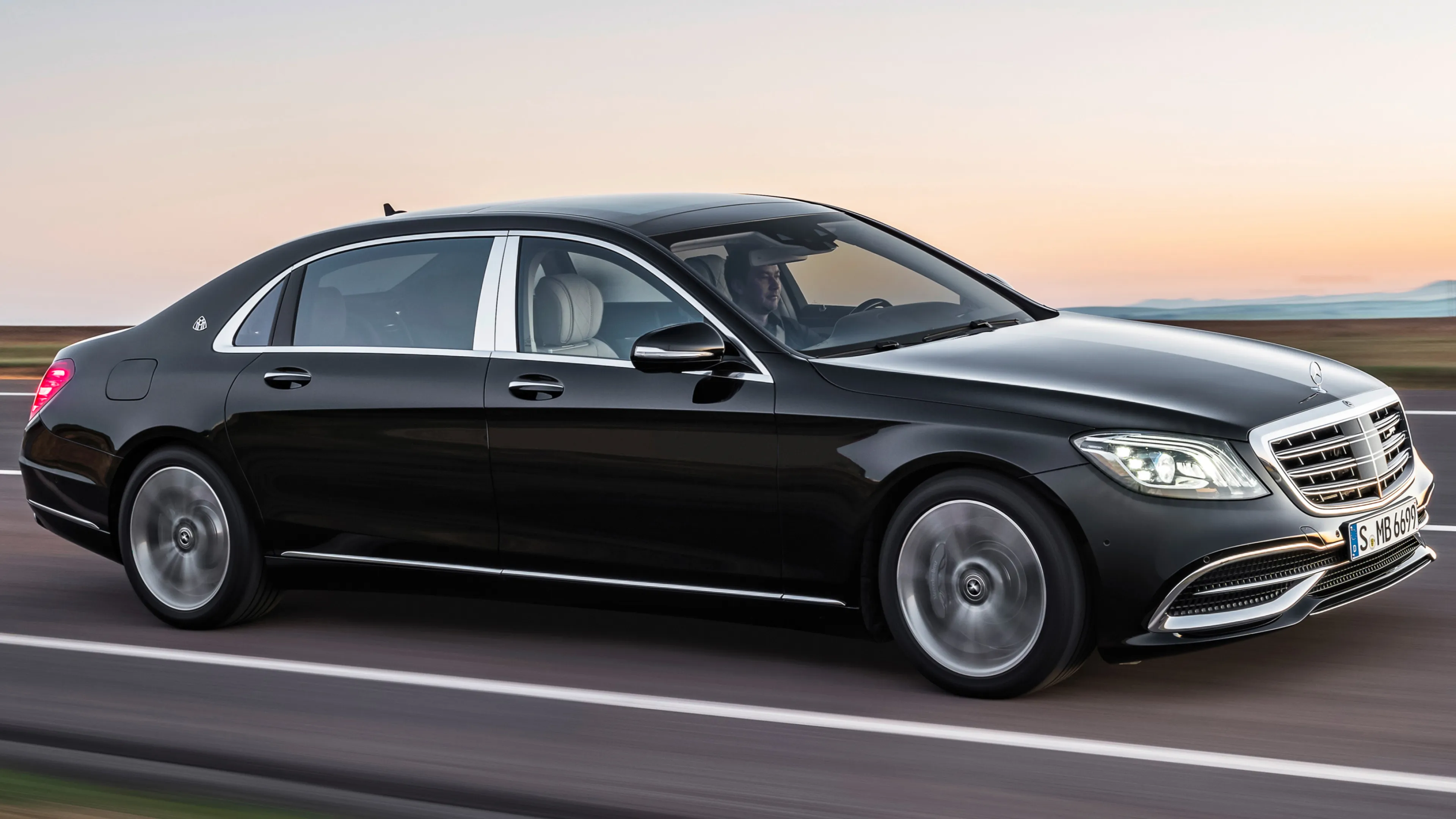 Black Mercedes Benz Luxury Sedan Driving on Highway image