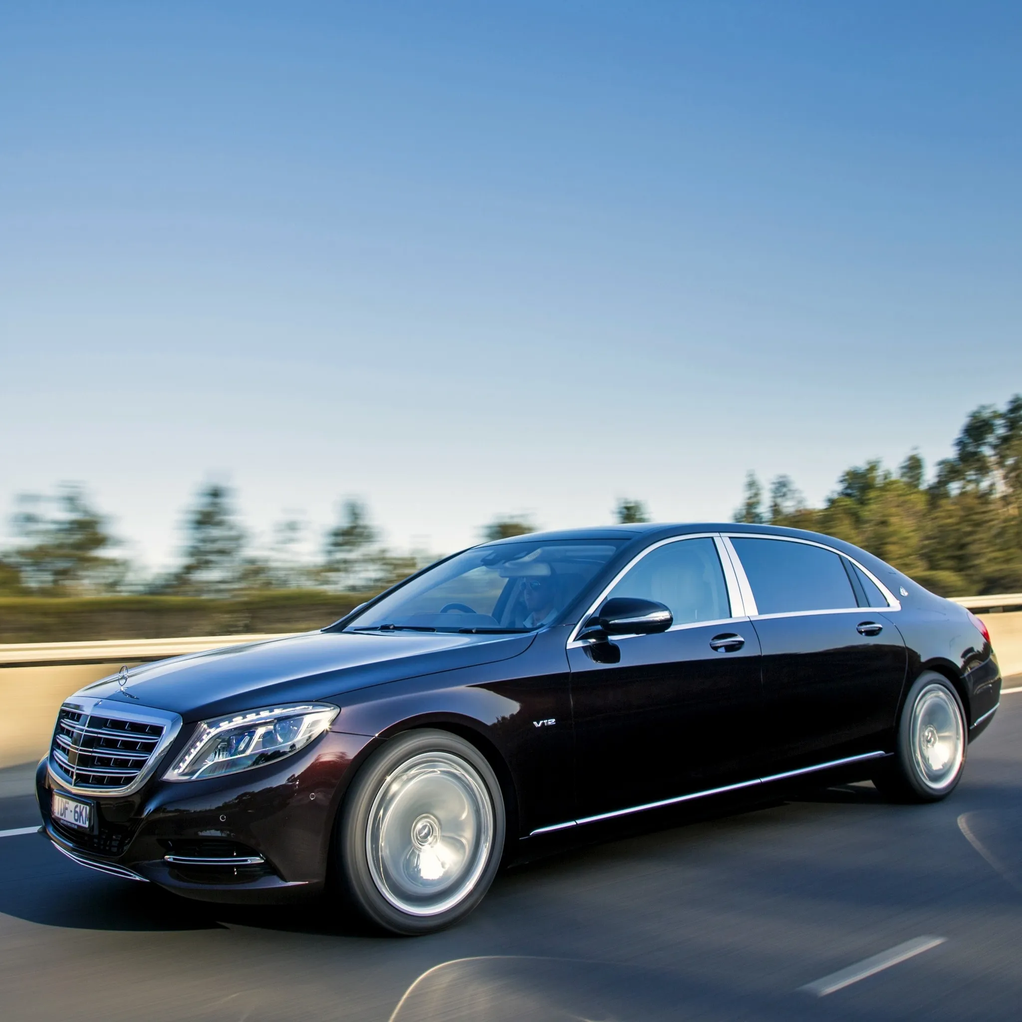 Black Mercedes Benz Luxury Sedan Driving on Open Highway
