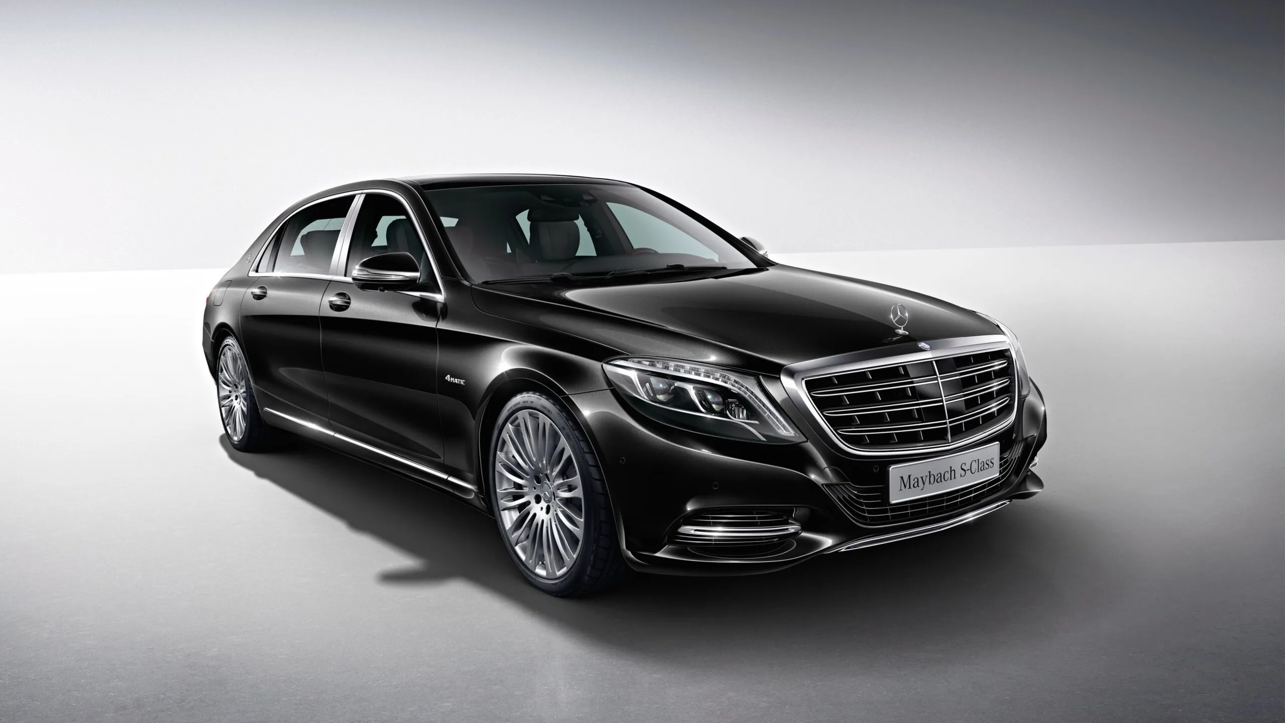Black Mercedes Benz Luxury Sedan in Studio Light Wallpaper