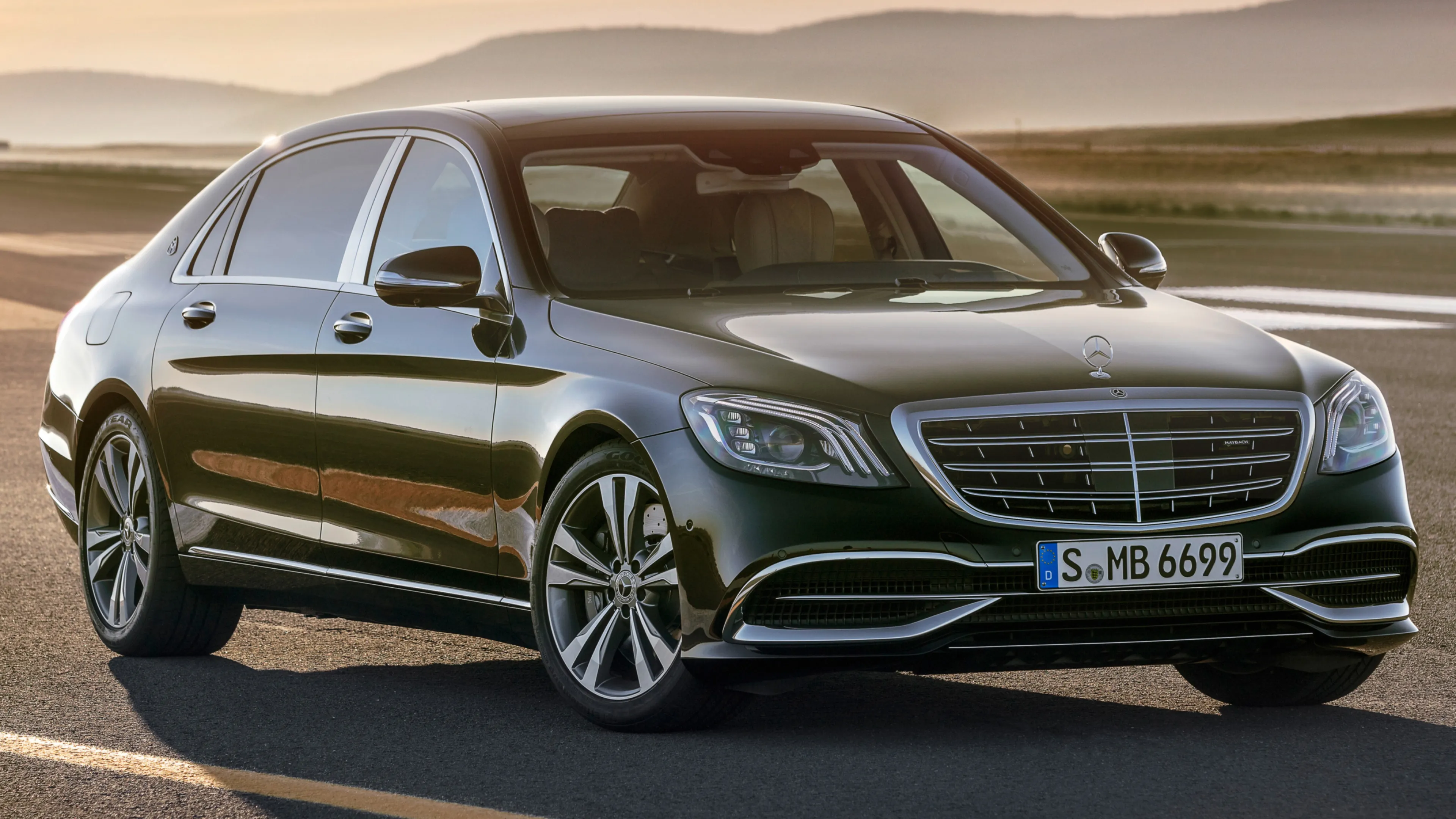 Black Mercedes Benz Luxury Sedan in Warm Sunset Light