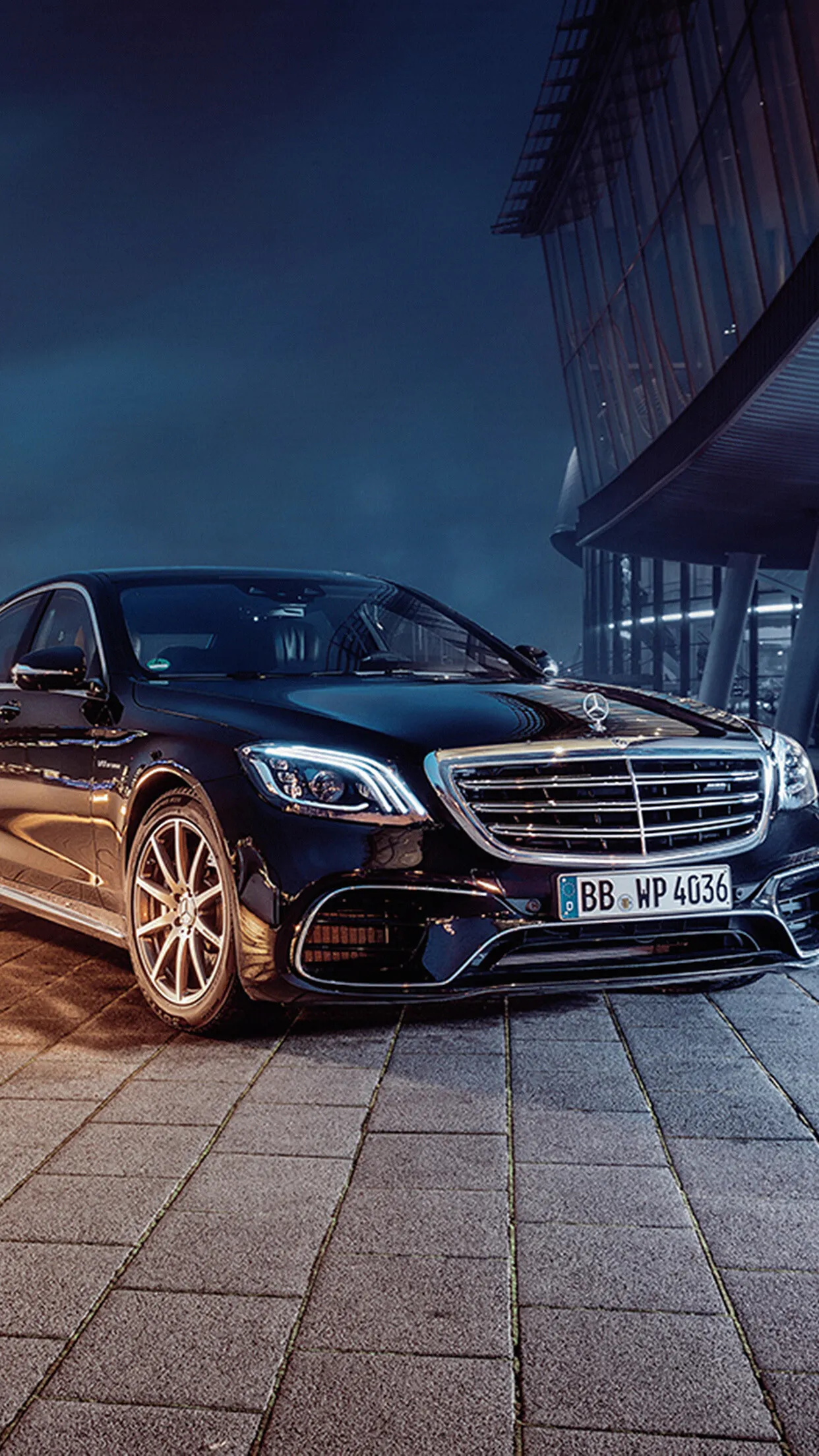 Black Mercedes Benz Luxury Sedan Parked at Night on Street