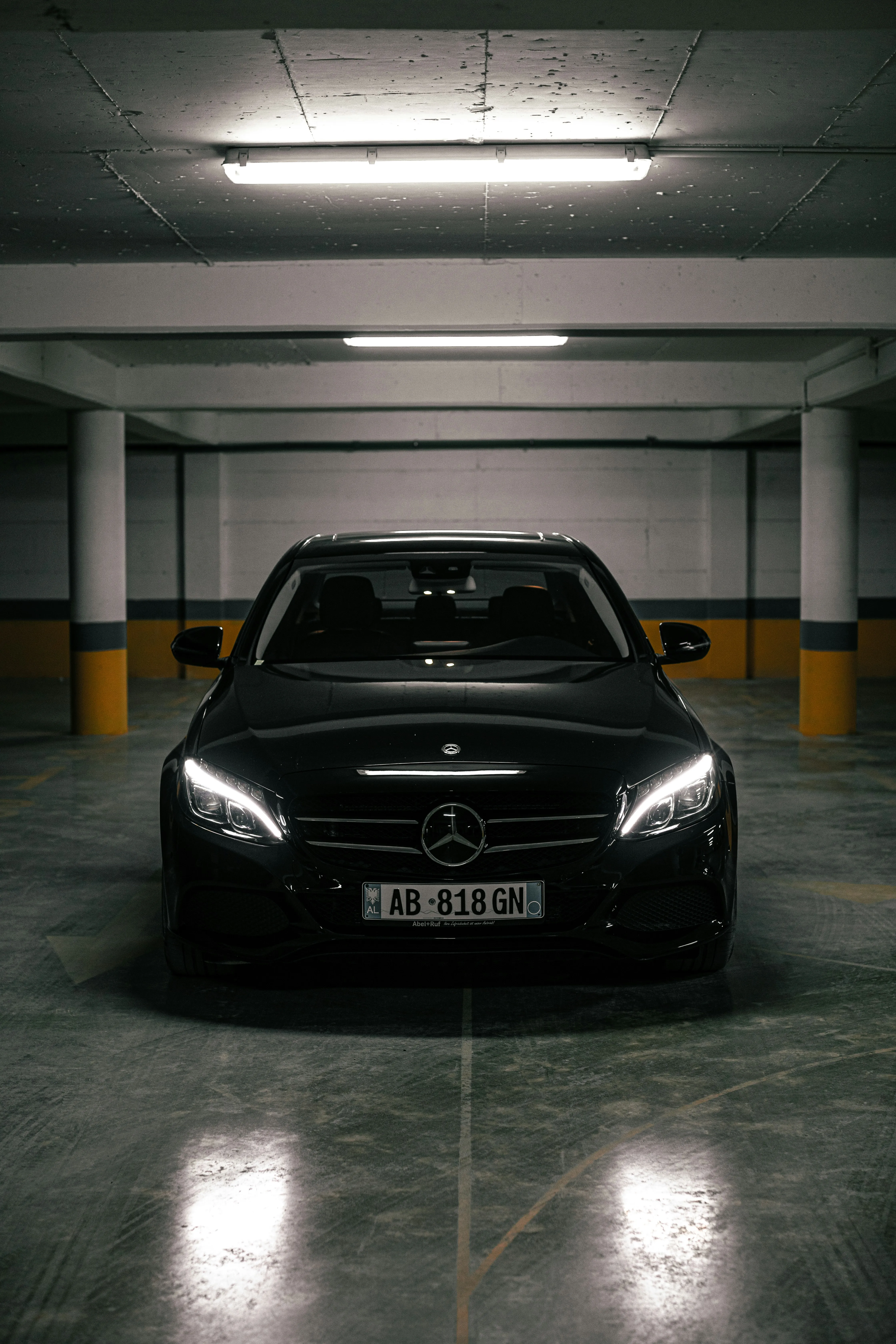 Black Mercedes Benz Parked in Basement Garage Wallpaper