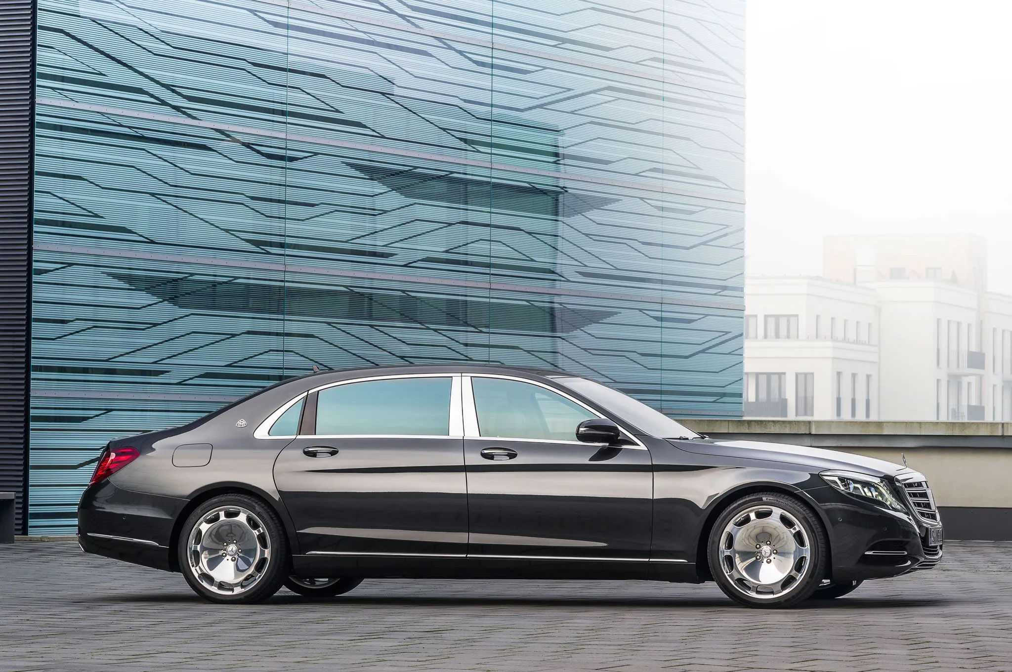 Black Mercedes Benz Sedan Against Modern Architecture HD