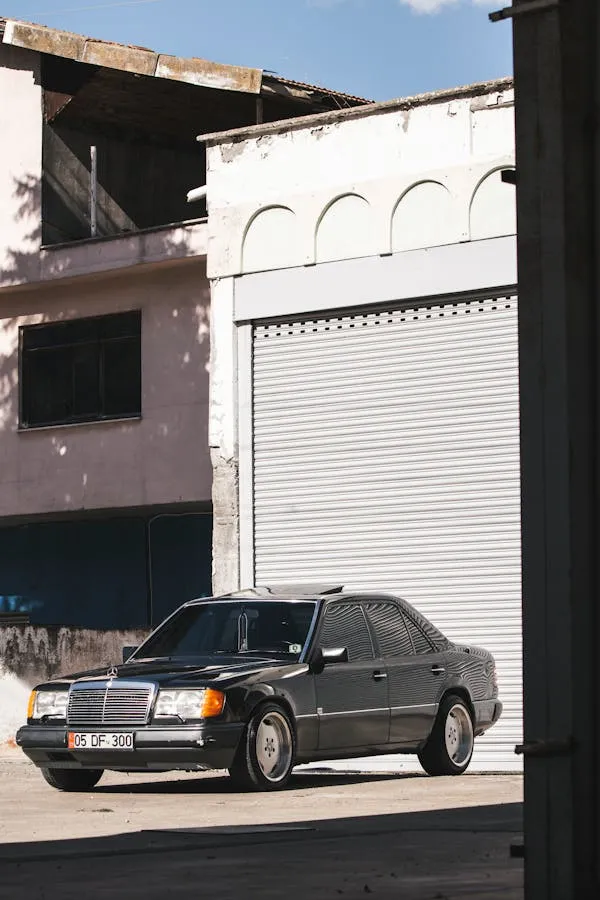 Black Mercedes Benz Sedan Parked by Urban Building HD