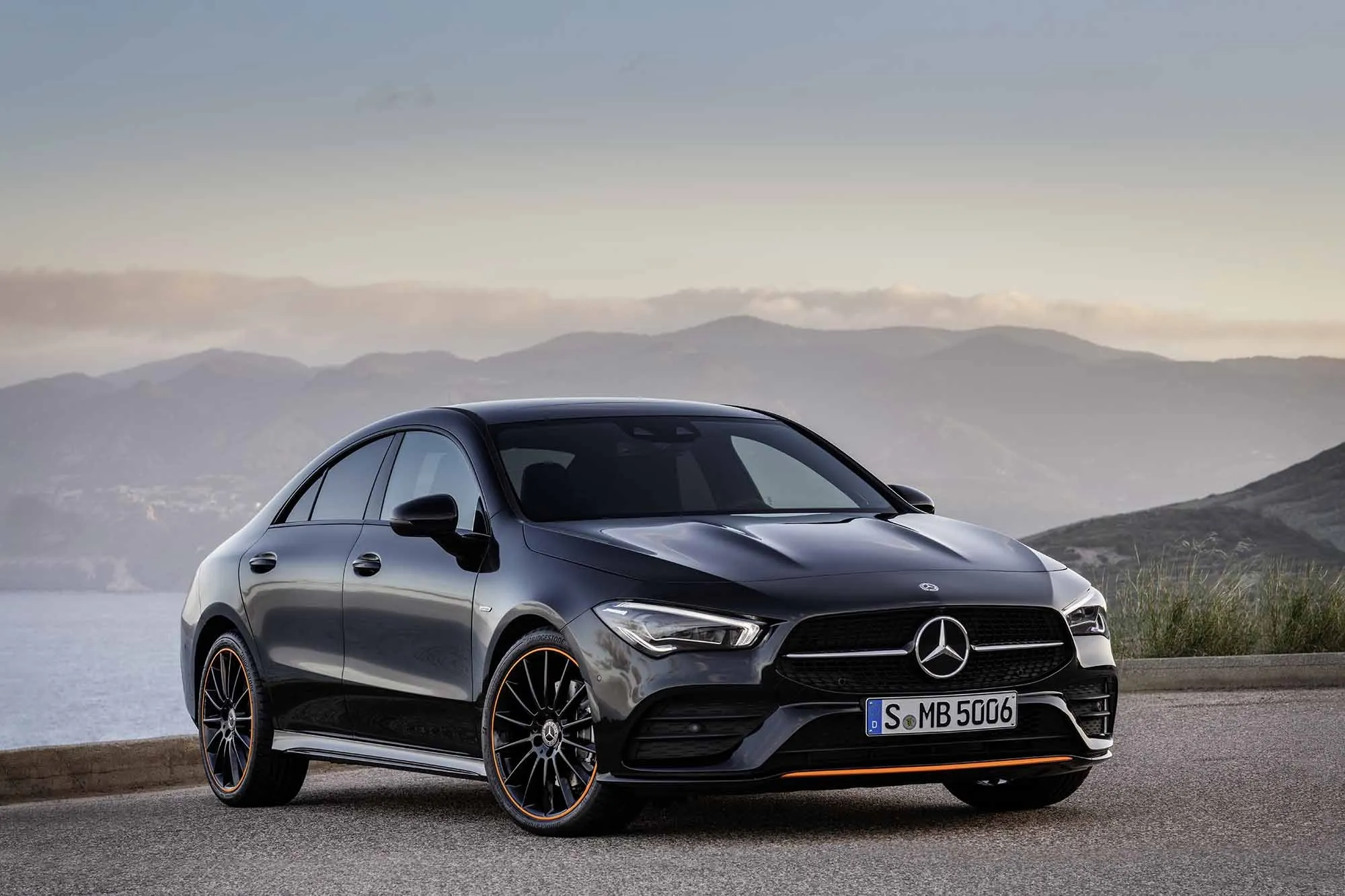 Black Mercedes Benz Sedan Parked with Mountain View