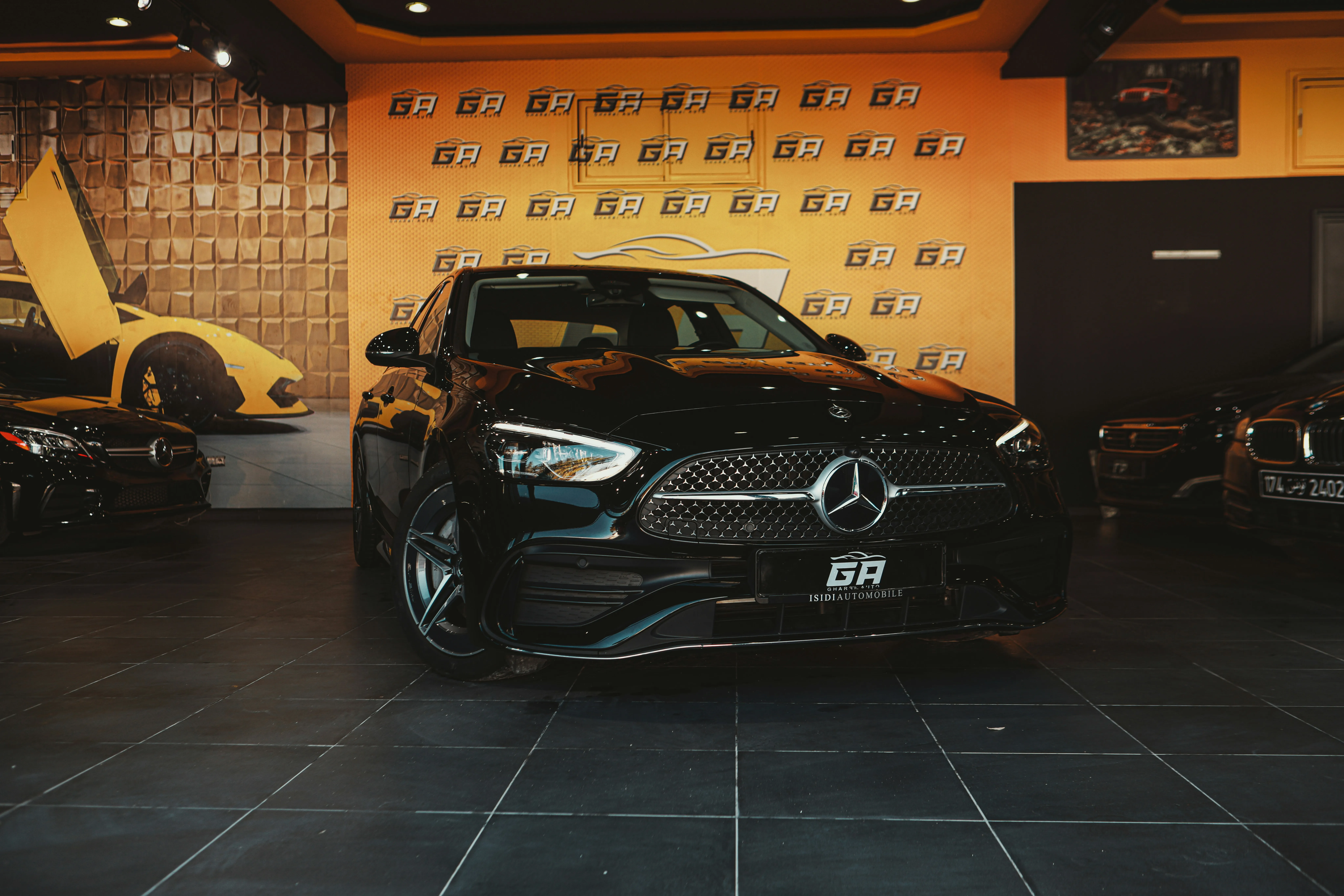 Black Mercedes Benz Showcased in a Modern Luxury Car Showroom