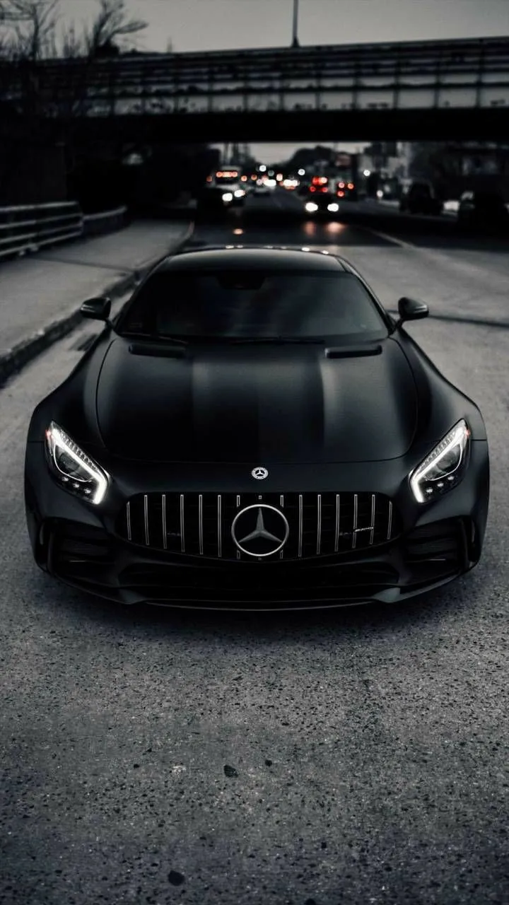 Black Mercedes Benz Sport Coupe in Dimly Lit Garage