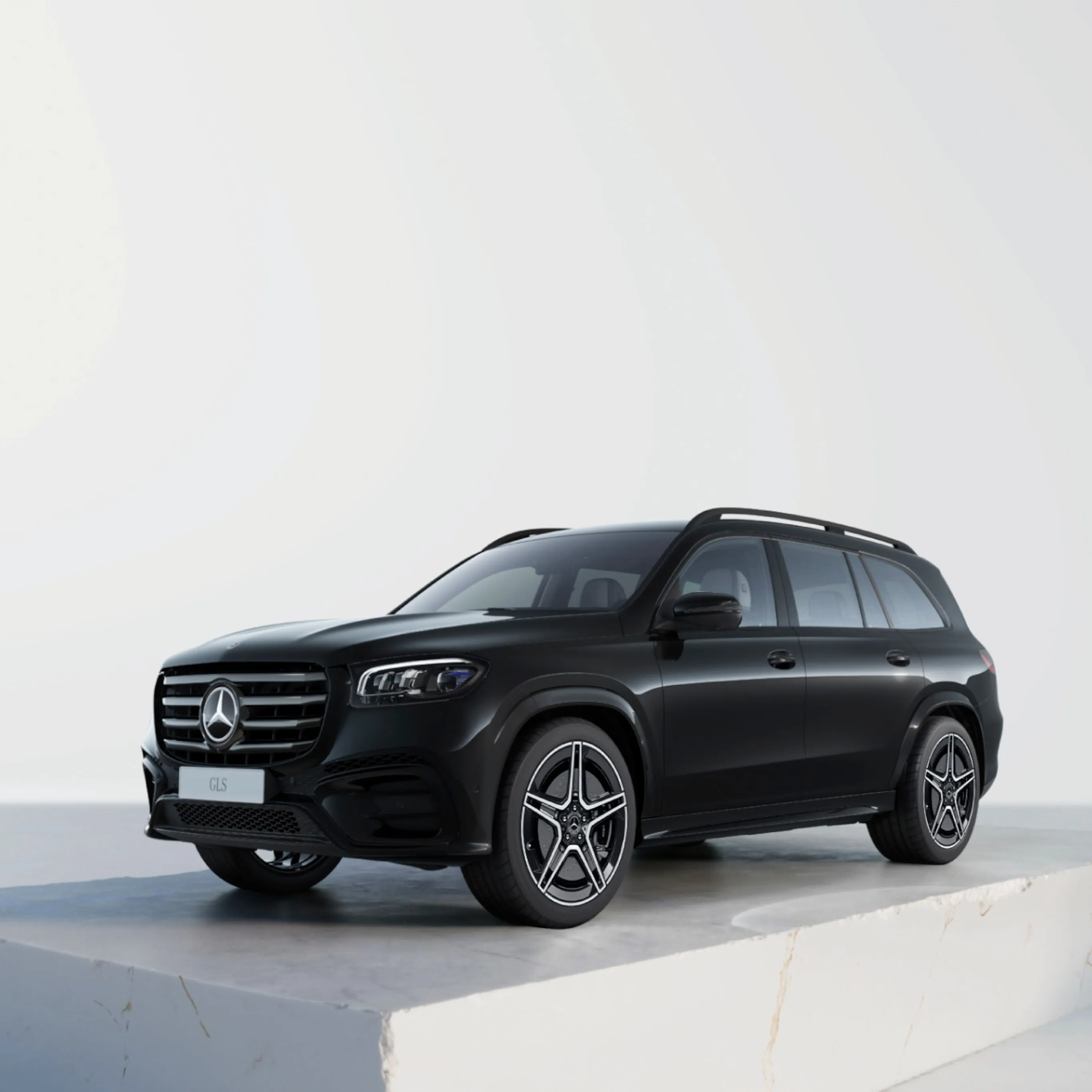 Black Mercedes Benz SUV on White Platform with Bright Backdrop