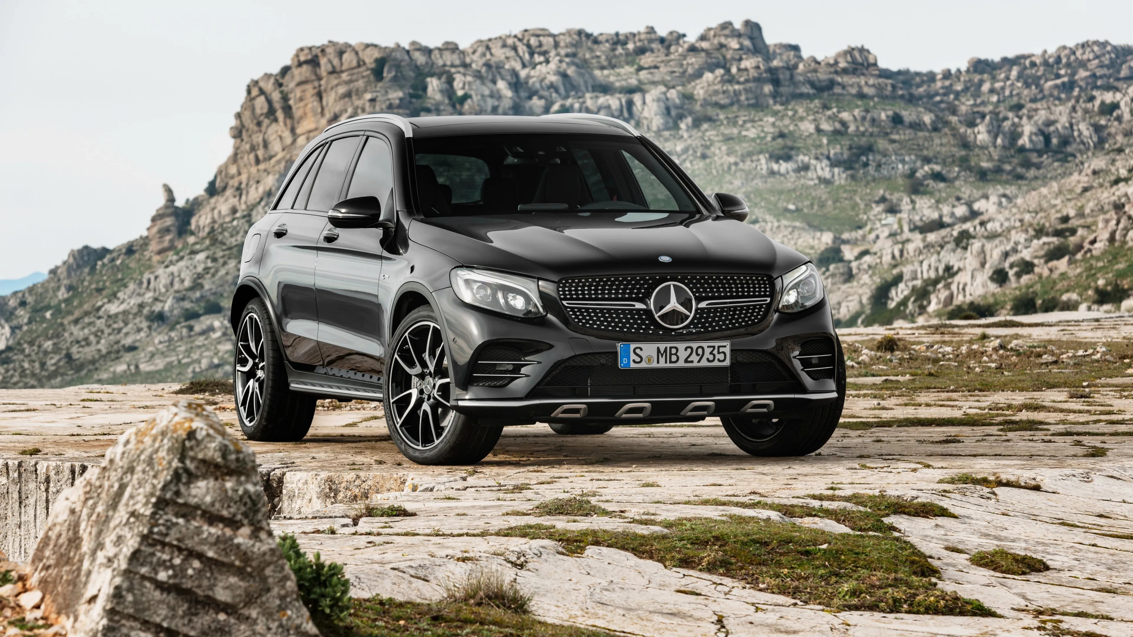 Black Mercedes Benz SUV Parked by Mountain Landscape