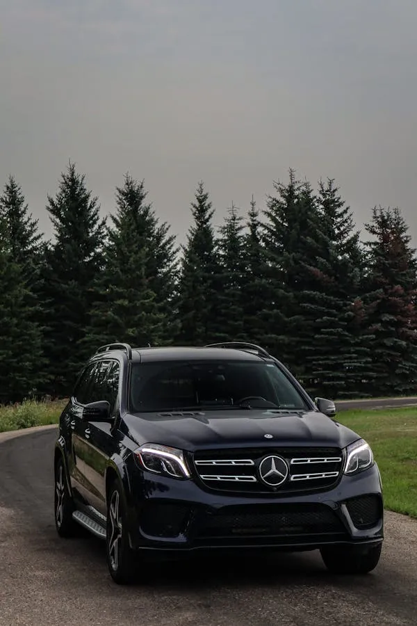 Black Mercedes Benz SUV Parked in Forest Clearing Wallpaper