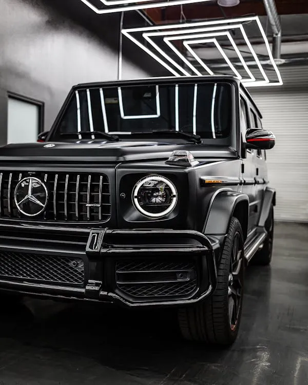 Black Mercedes Benz SUV Parked in Modern Urban Garage