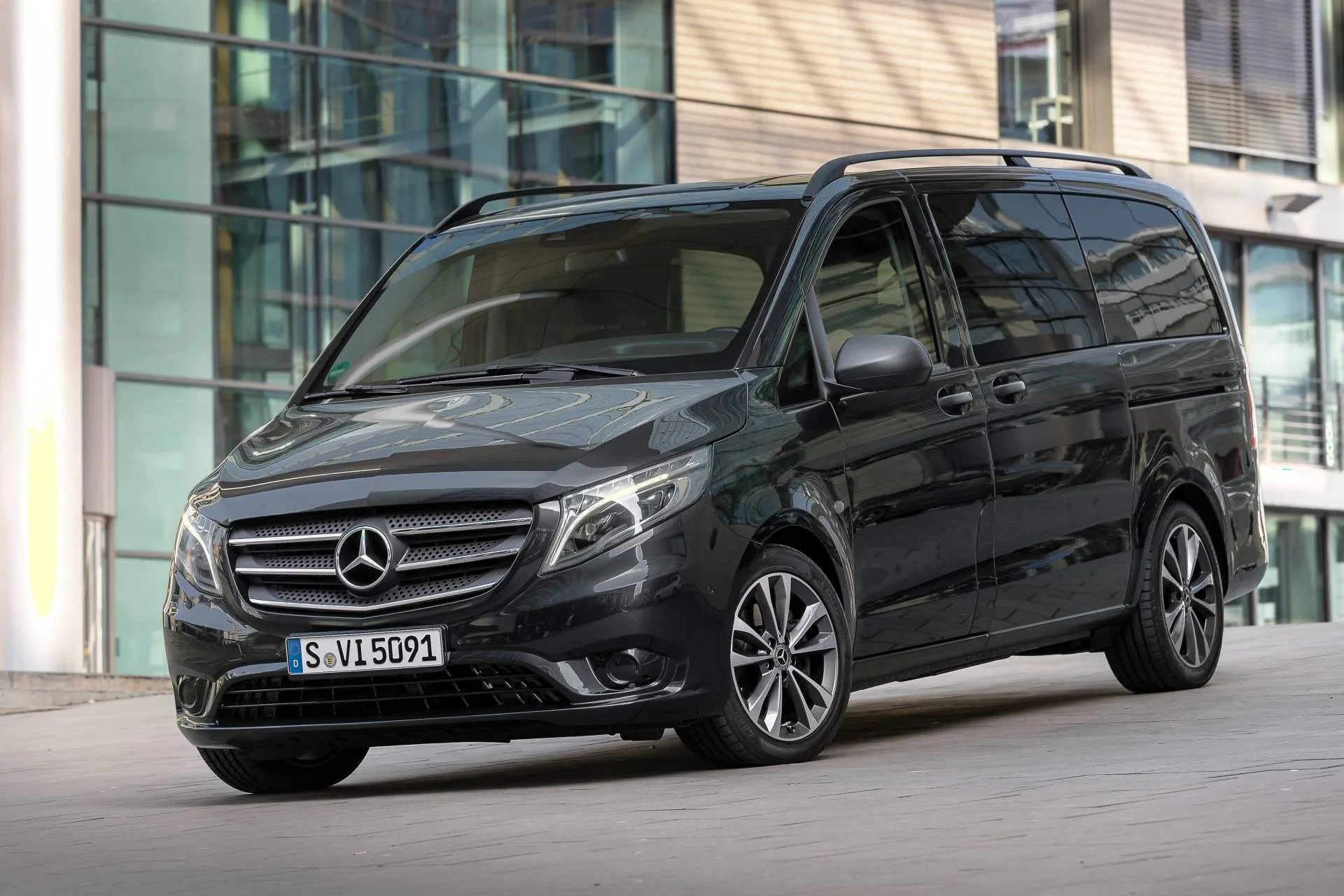 Black Mercedes Benz Van Parked Near Modern Office Building