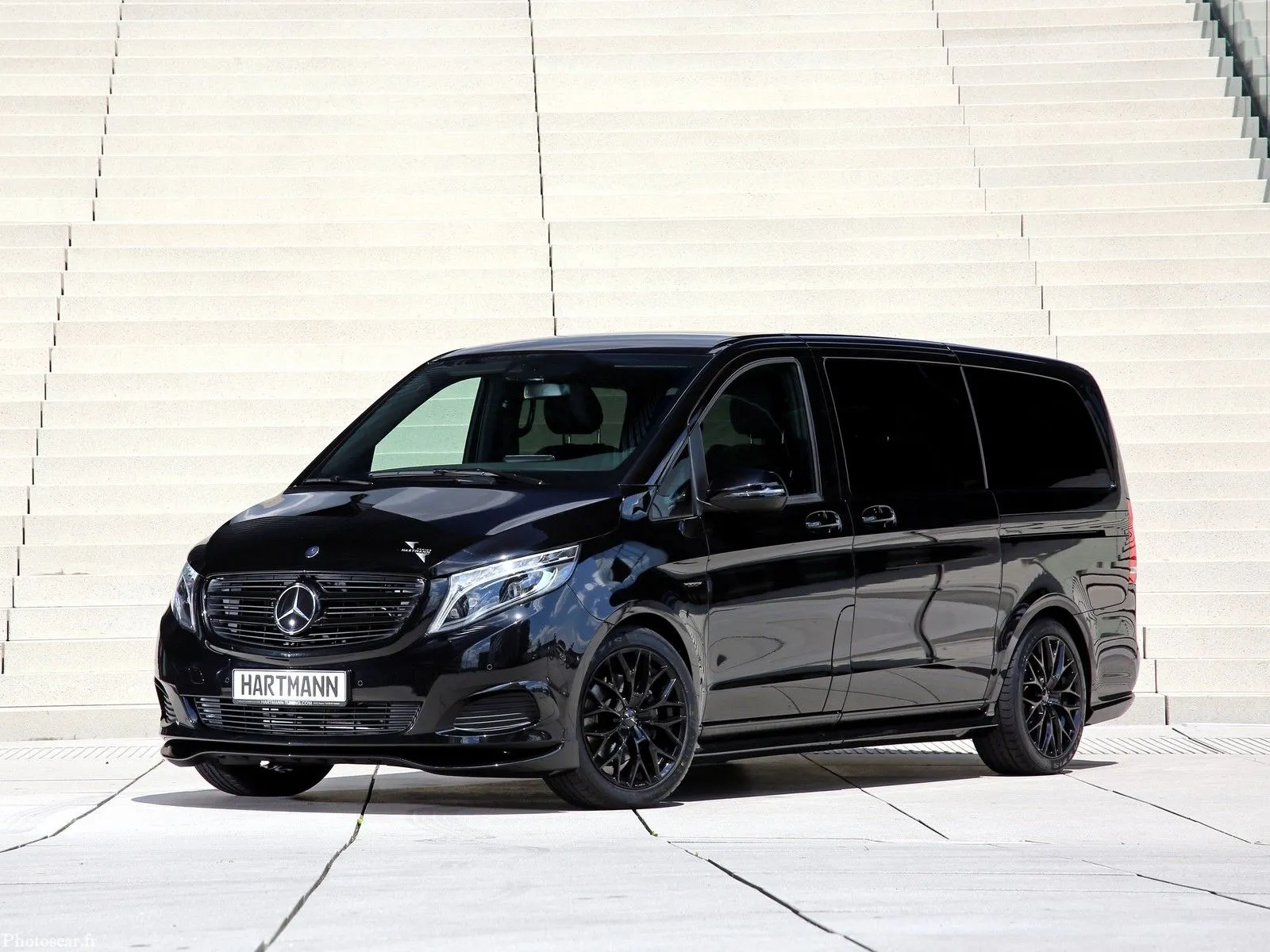 Black Mercedes Benz Van Parked on White Steps Outdoors
