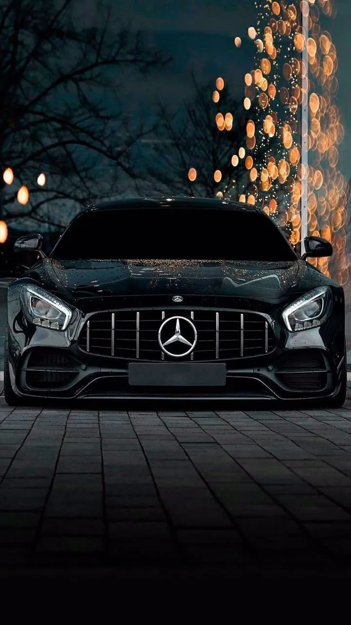 Black Mercedes Benz with Lights On in Dark Setting