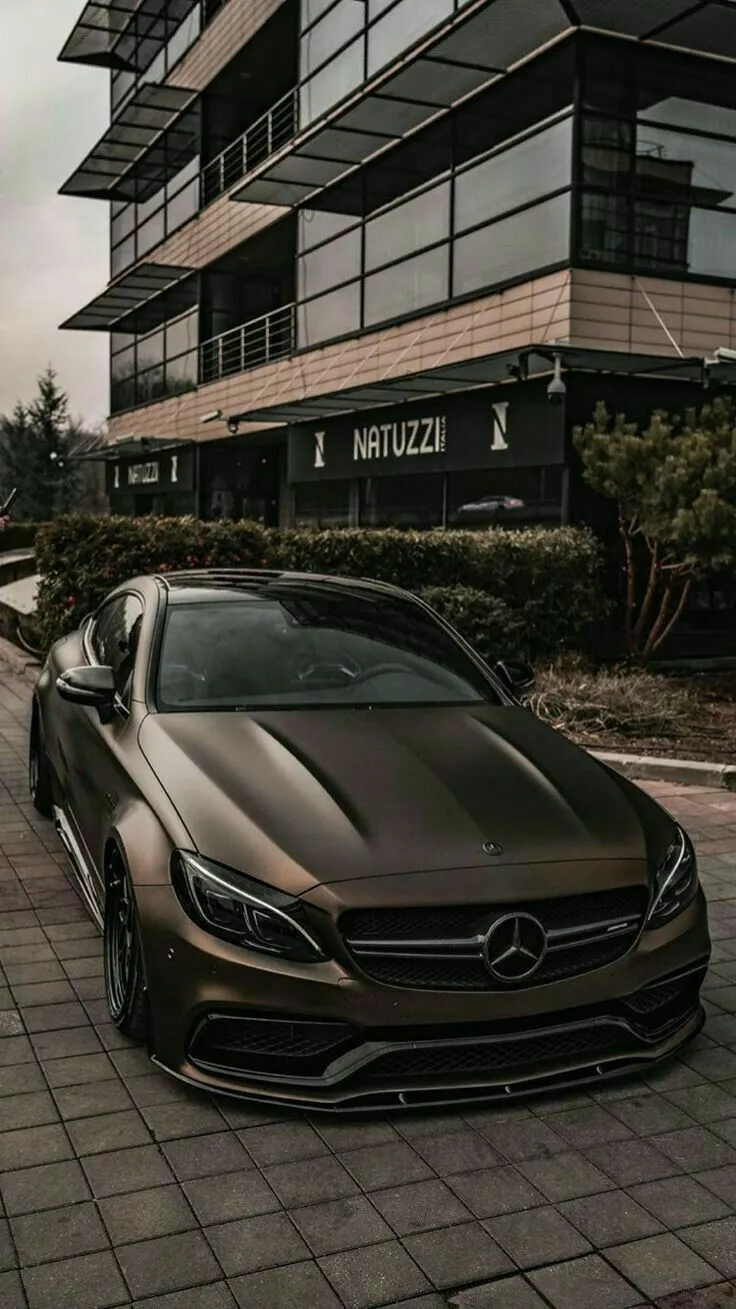 Black Mercedes Coupe Parked in Modern Complex Wallpaper