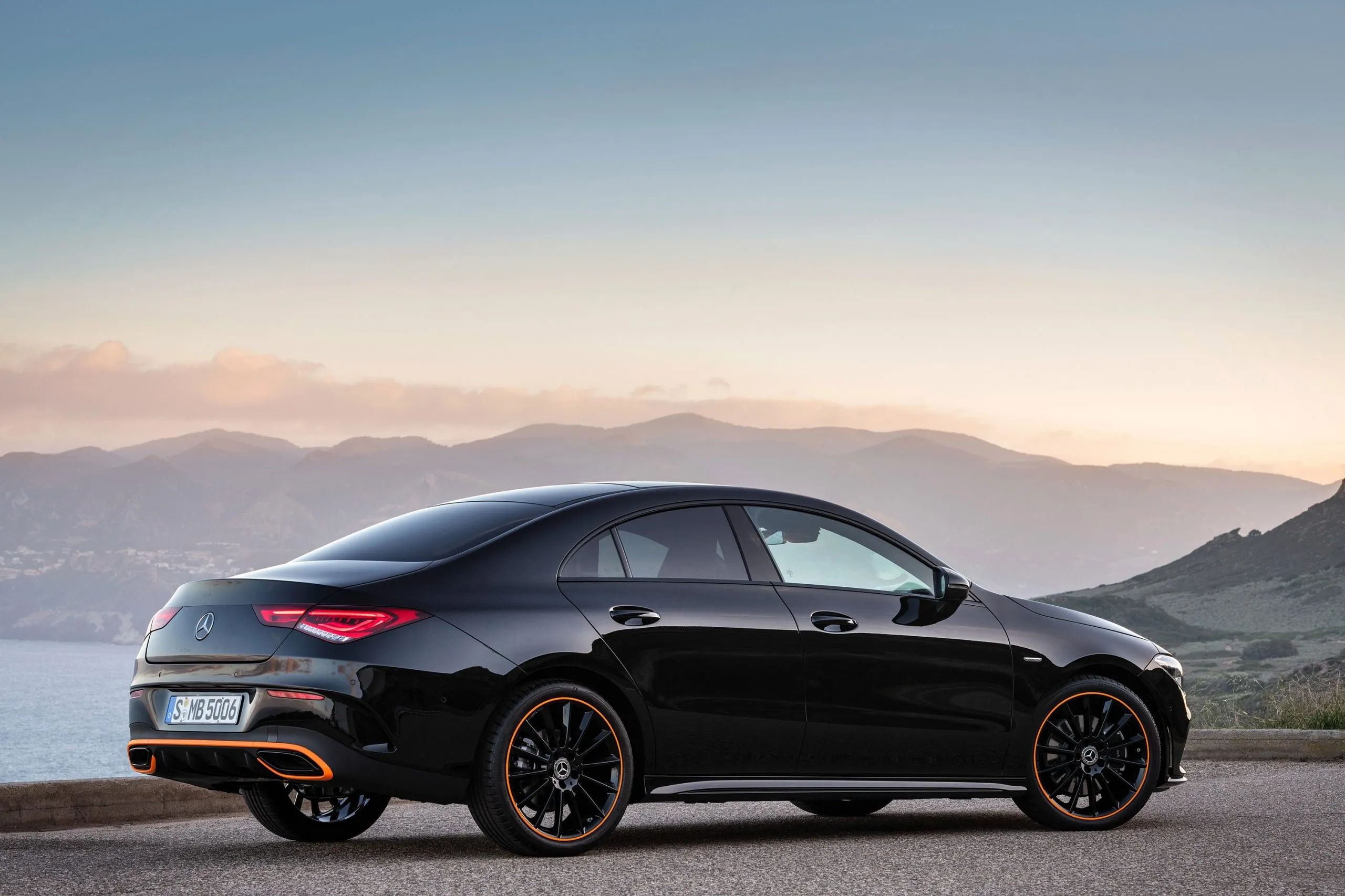 Black Mercedes Coupe Parked Overlooking Scenic Hills