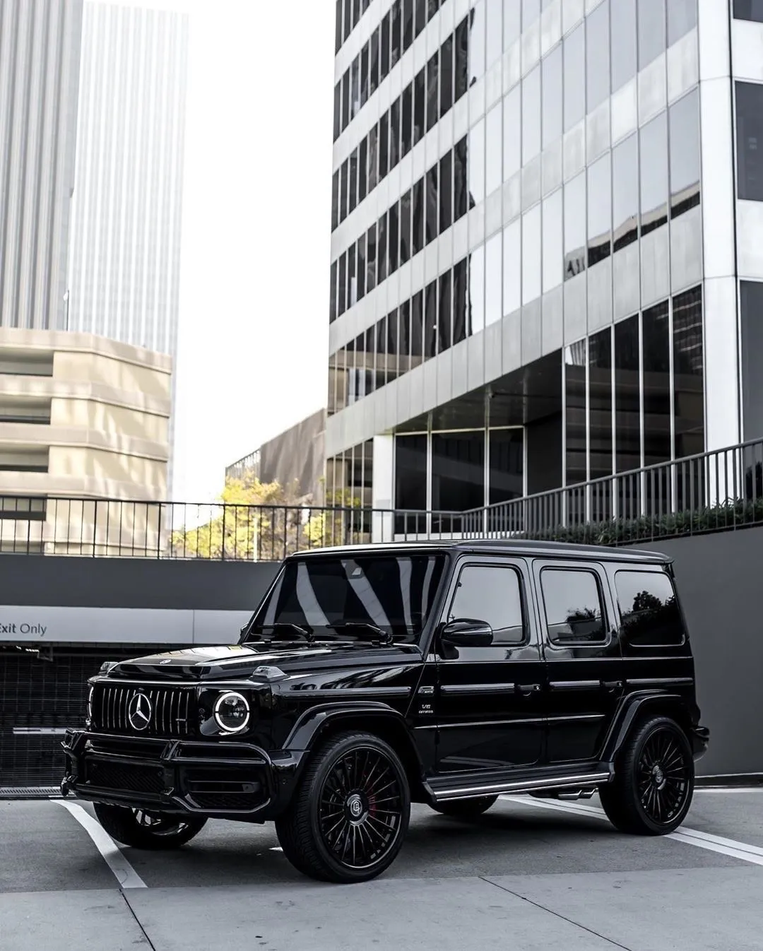 Black Mercedes G Wagon Parked in Modern Cityscape