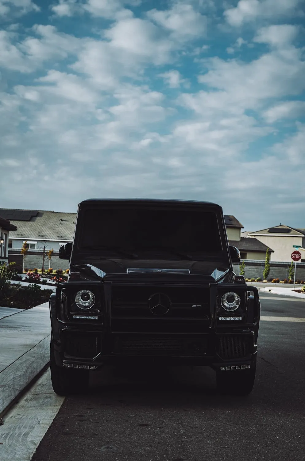 Black Mercedes GClass in Residential Zone free Wallpaper