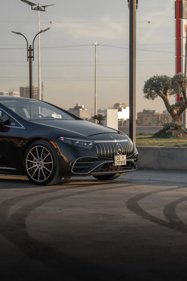Black Mercedes on City Street with Urban Background