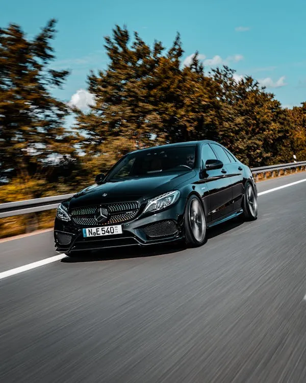 Black Mercedes Sedan Driving Fast on Scenic Highway HD