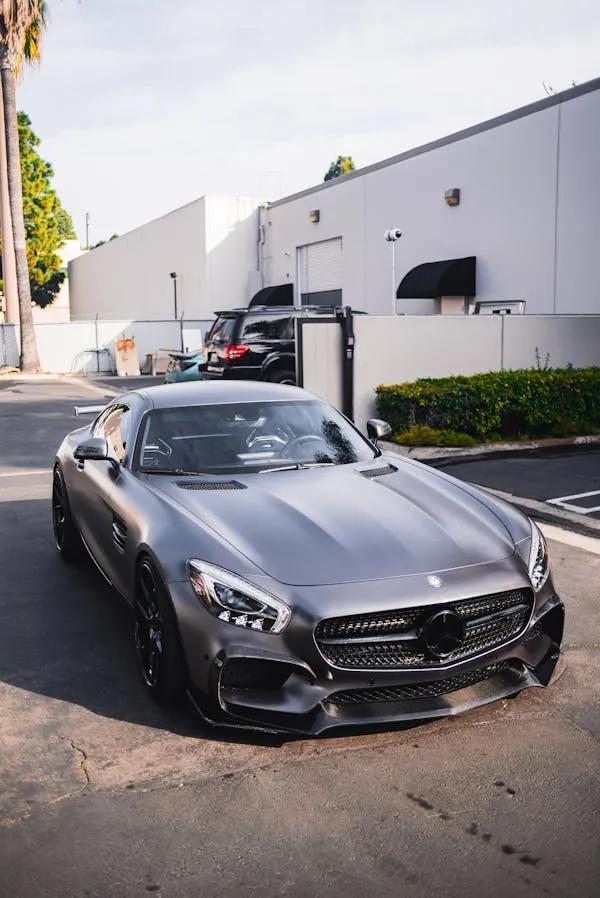 Black Mercedes Sports Car in Urban Business Area Wallpaper