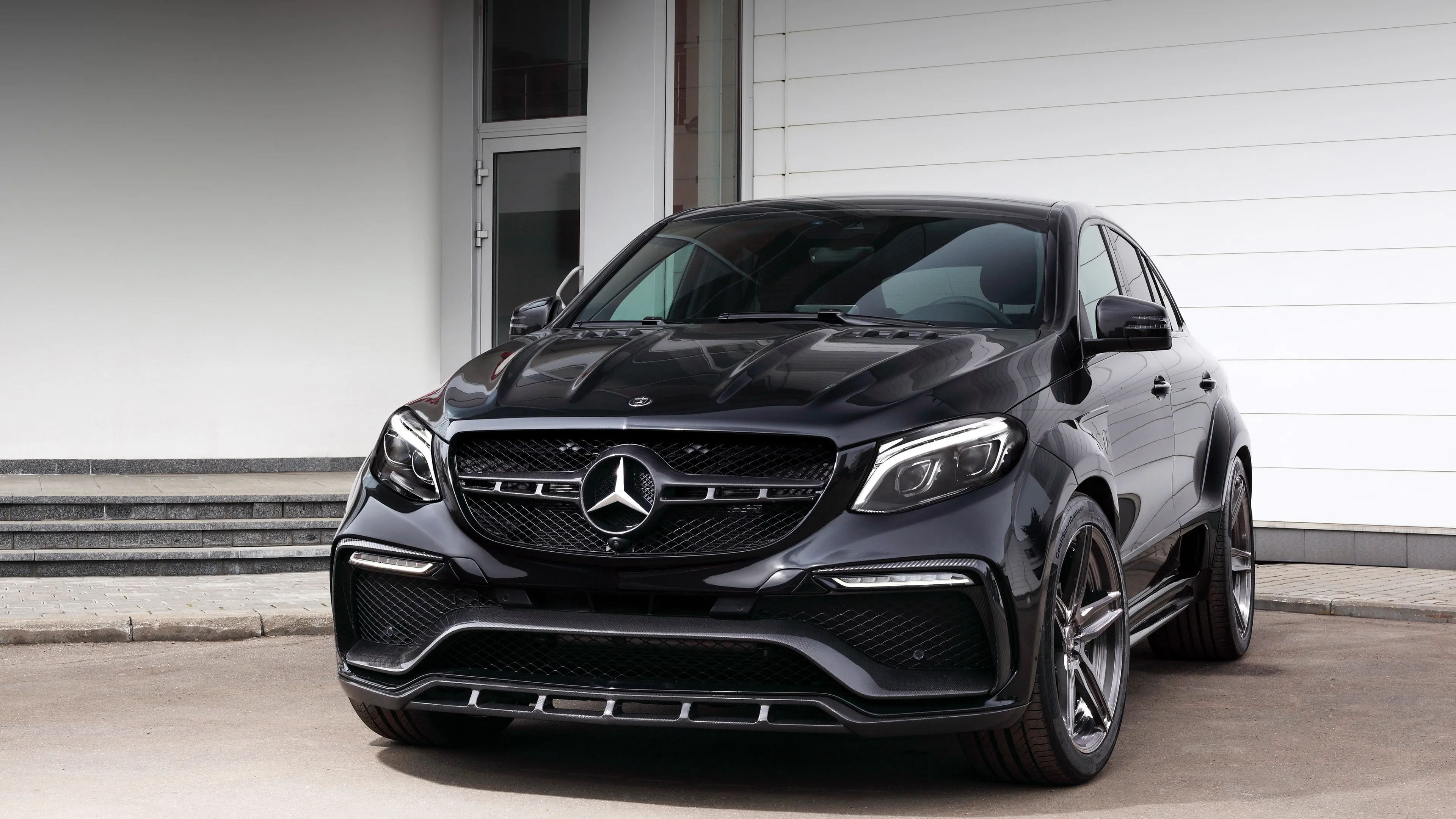 Black Mercedes SUV Parked by Minimal Modern Home Design