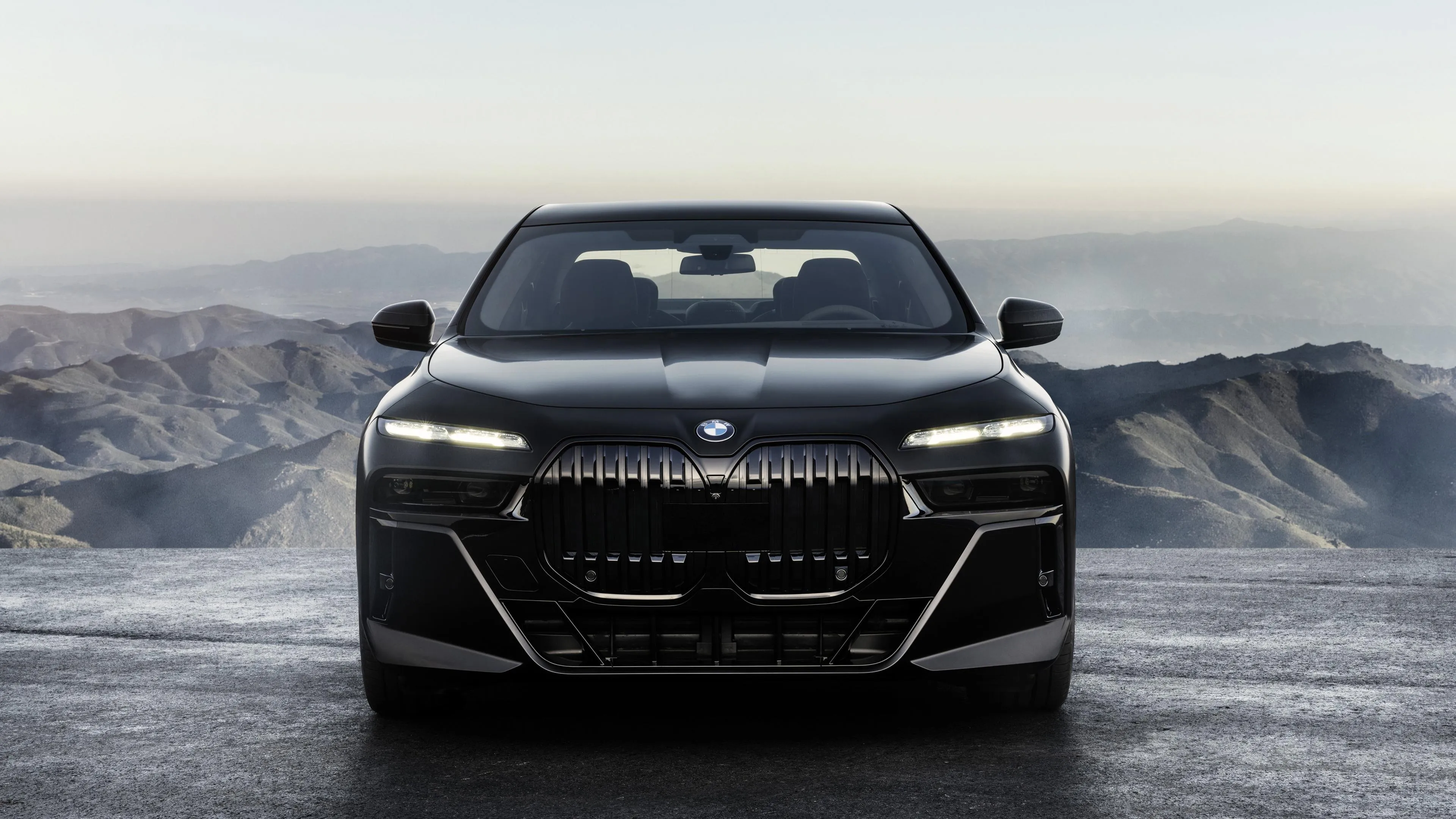 Black Modern Bmw Front View with Headlights Glowing
