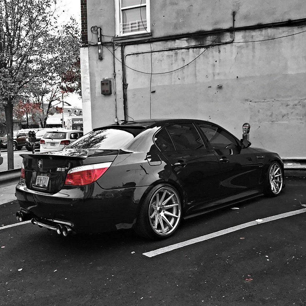 Black Modified Bmw Parked in an Urban Parking Lot Image