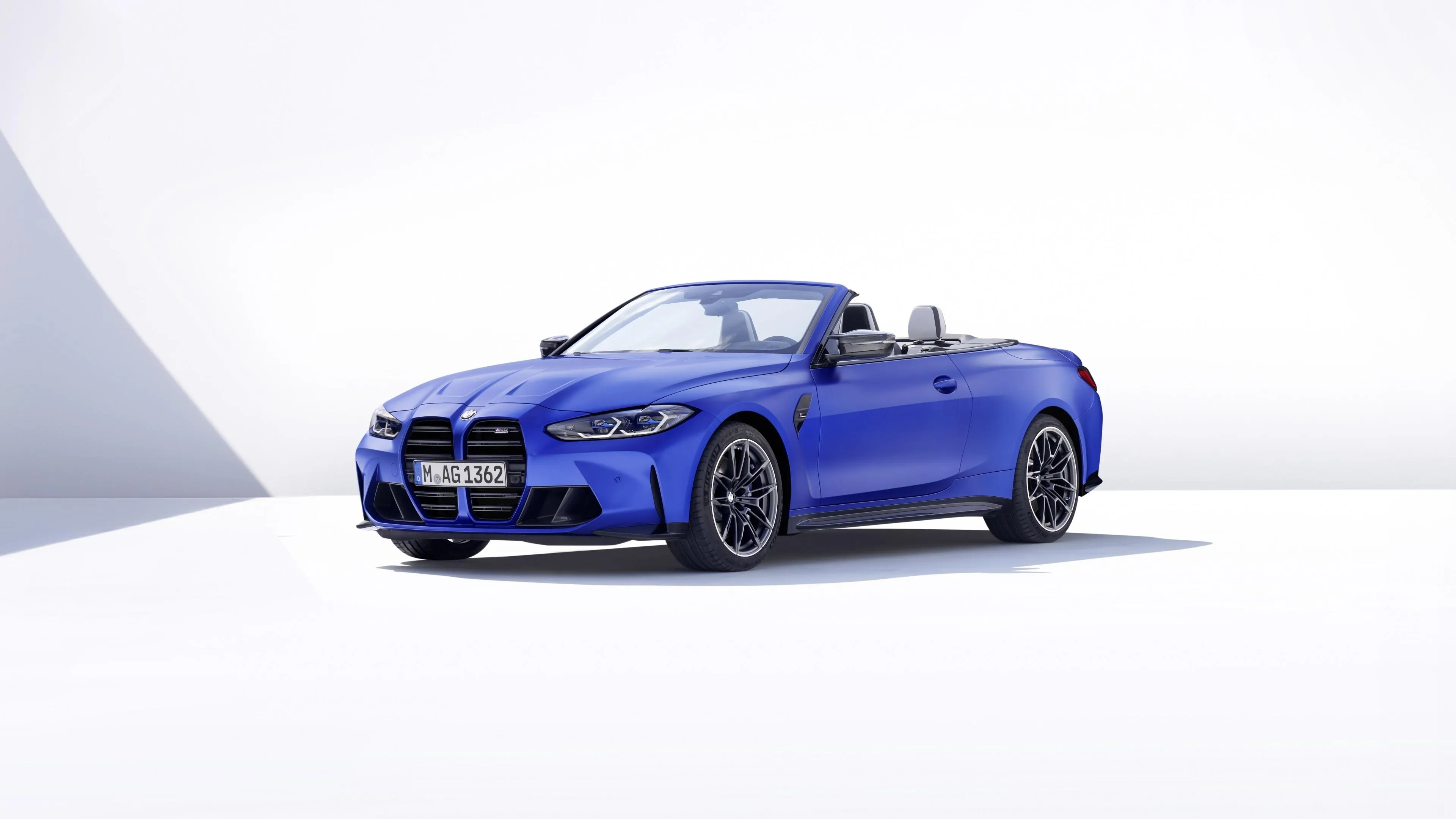 Blue Bmw Convertible Car Against a White Backdrop Image