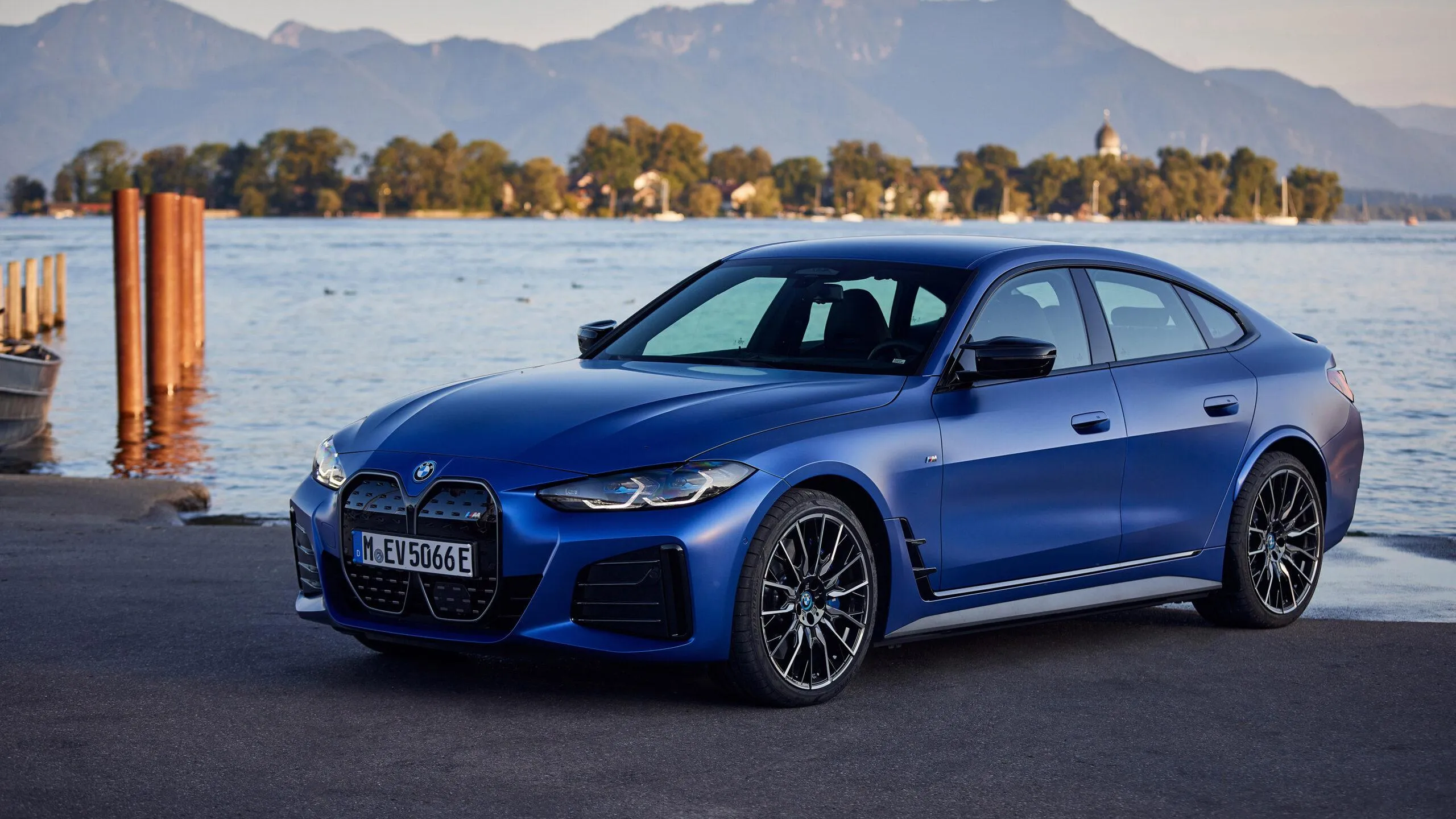 Blue Bmw Coupe Parked By Lake with Hills in the Distance