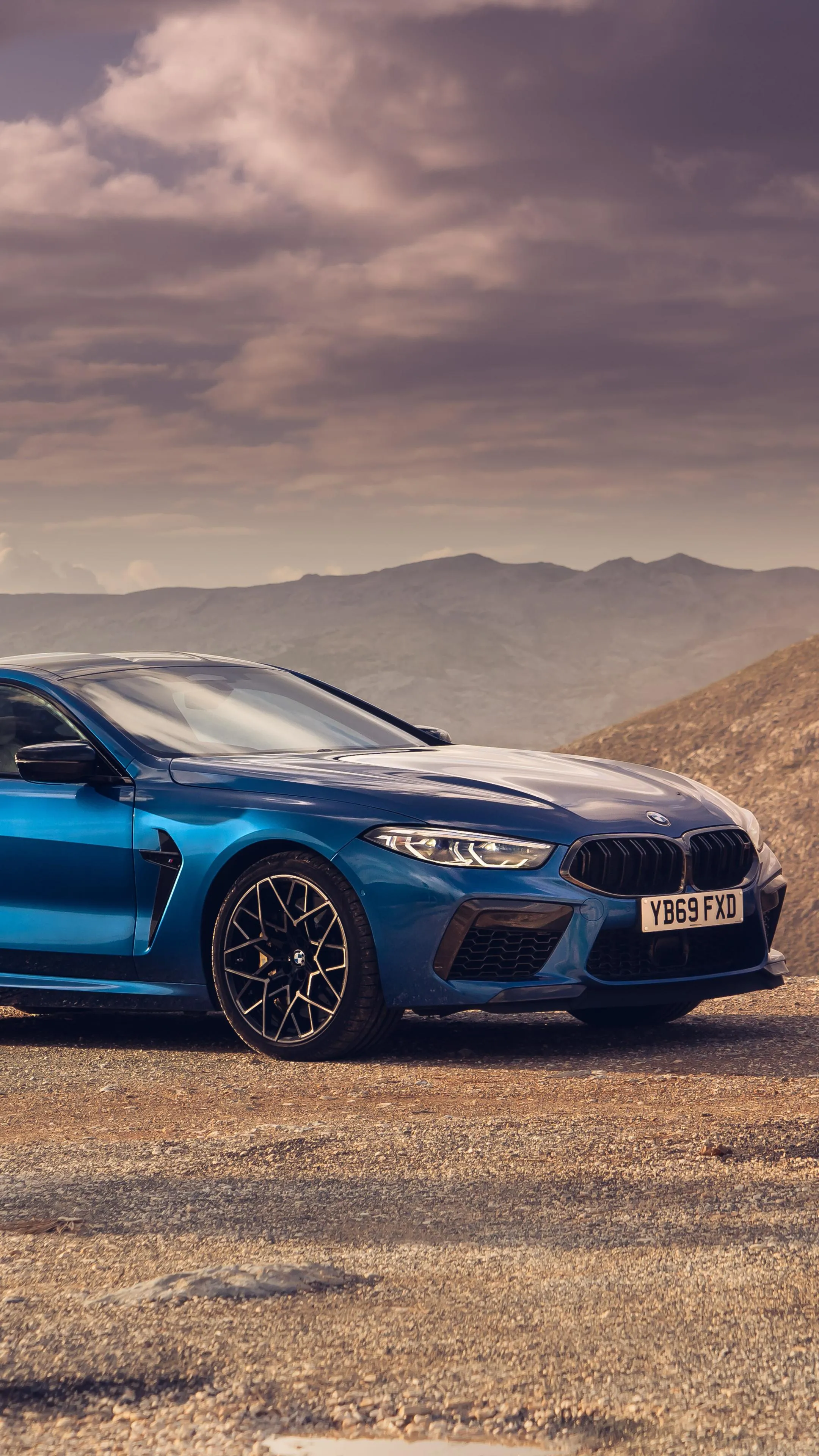 Blue Bmw Coupe Parked in Desert at Golden Hour Wallpaper