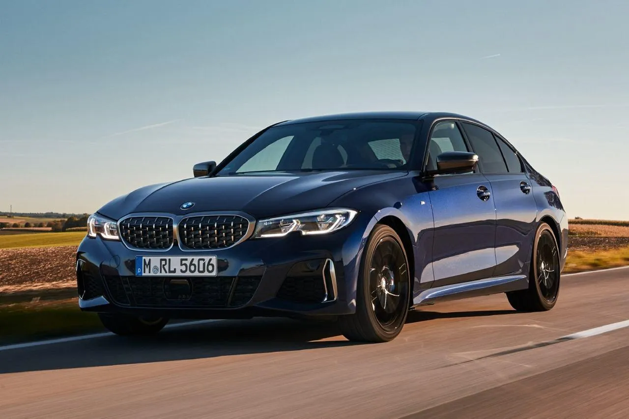 Blue Bmw Driving Fast on Highway During Sunny Daytime