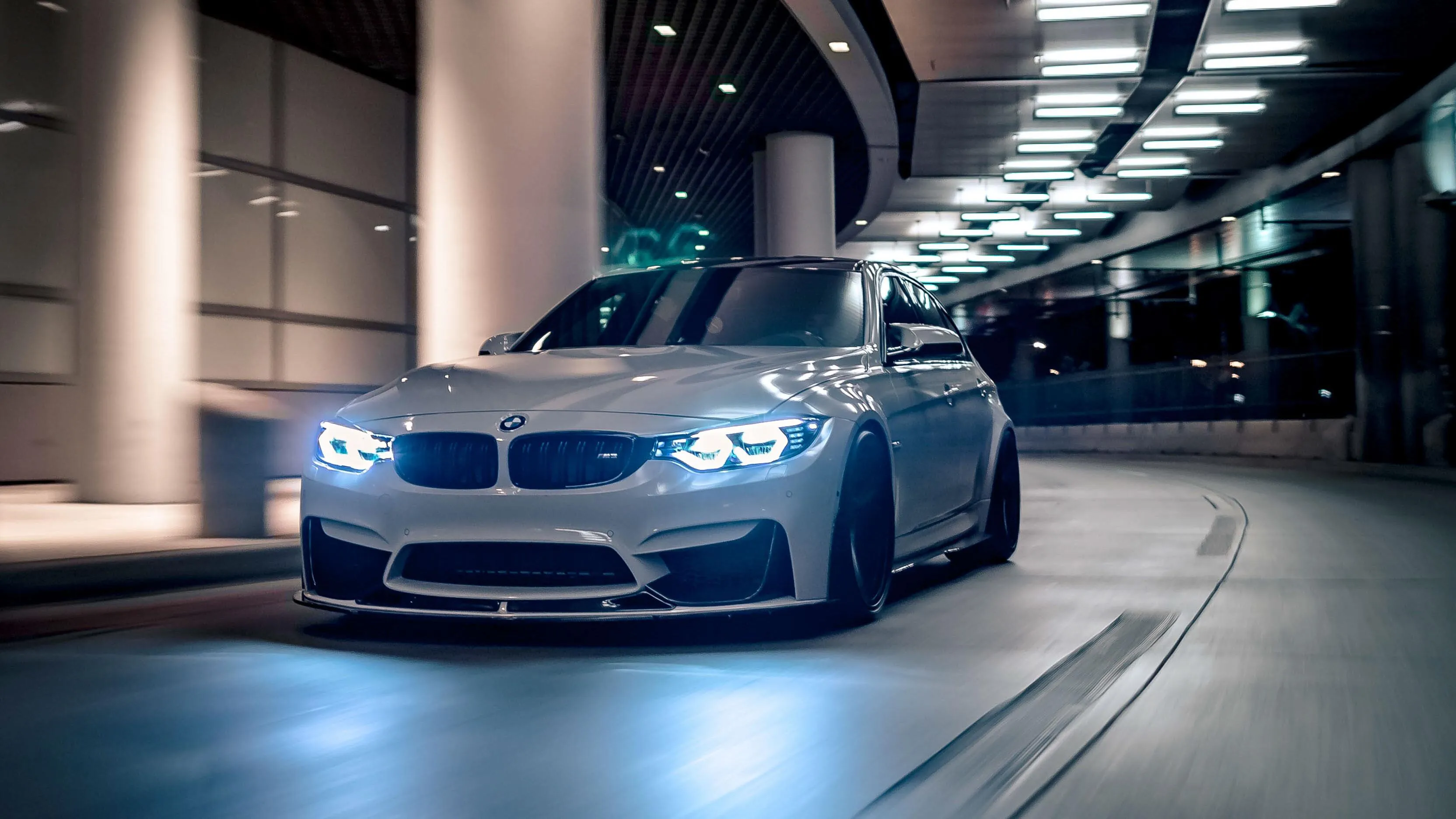Blue Bmw Driving Inside a Tunnel with Neon Lights Hd Image
