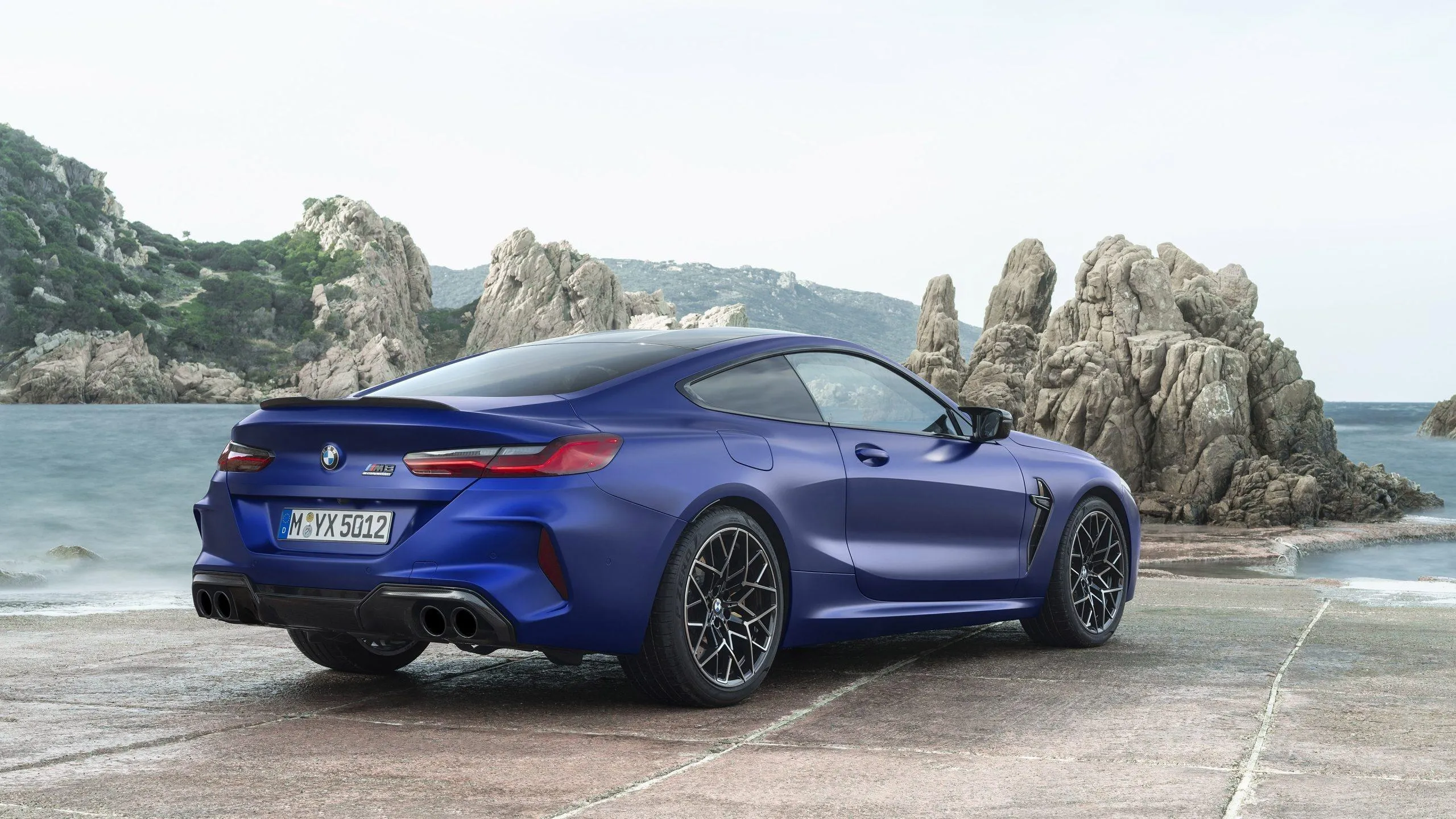 Blue Bmw Parked at Seaside with Rocky Cliffs and Ocean