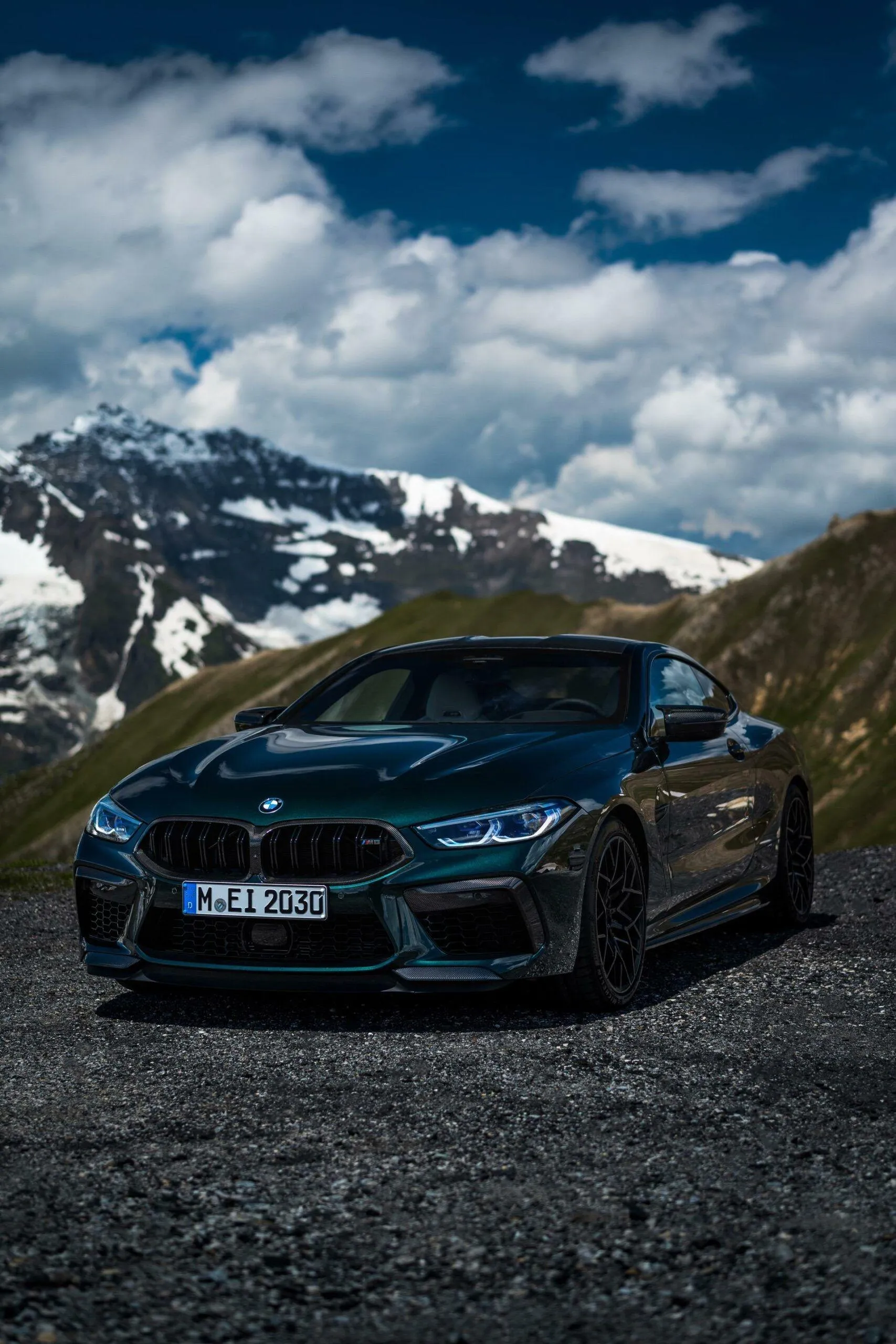 Blue Bmw Parked Near Mountains Under Blue Sky Wallpaper