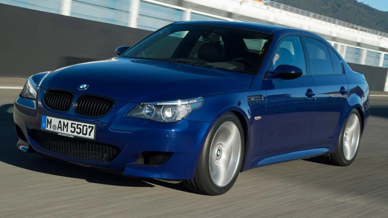 Blue Bmw Sedan Driving Fast on a City Road 4K Wallpaper