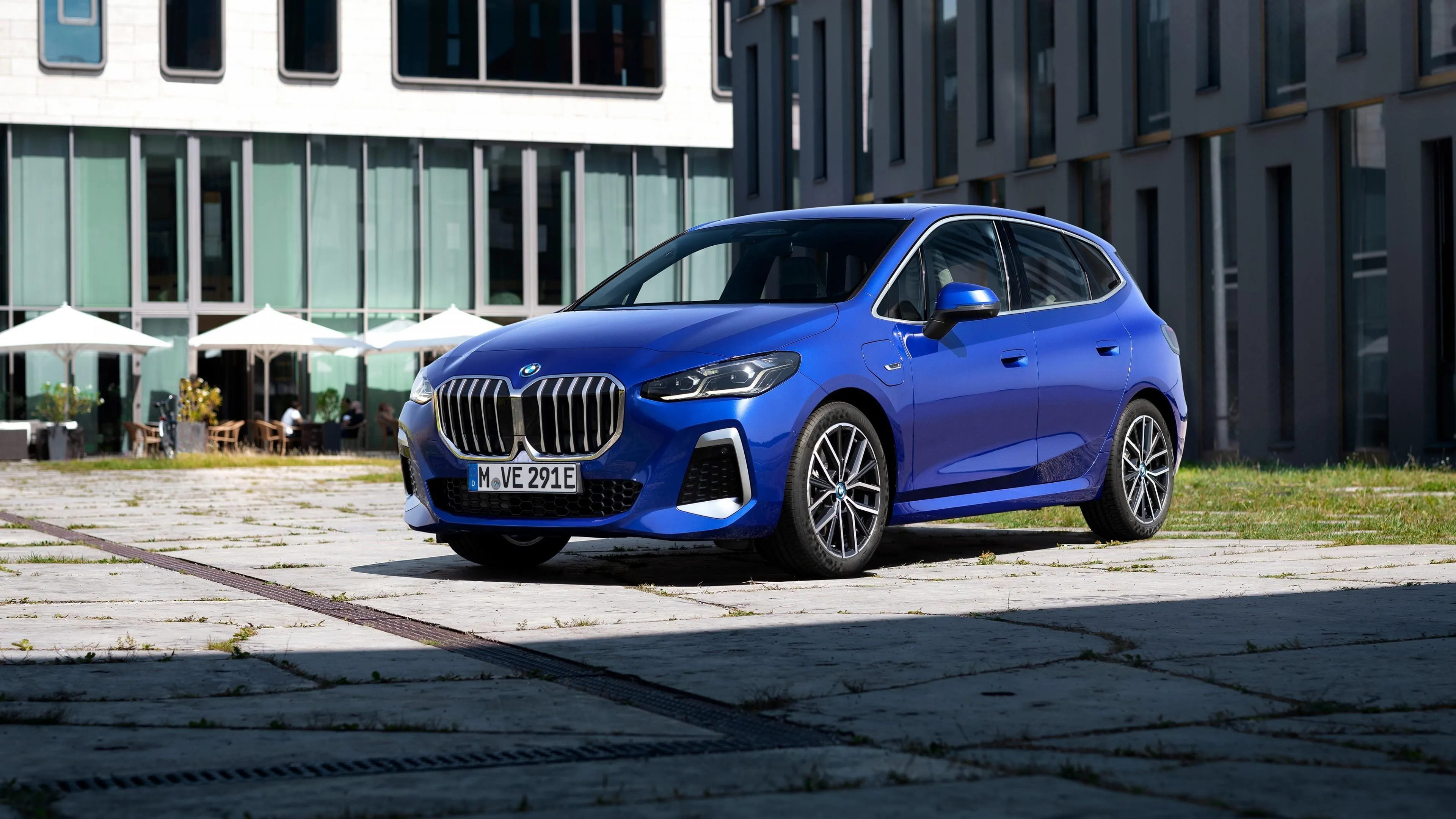 Blue Bmw Sedan Parked in Front of Modern Office Wallpaper
