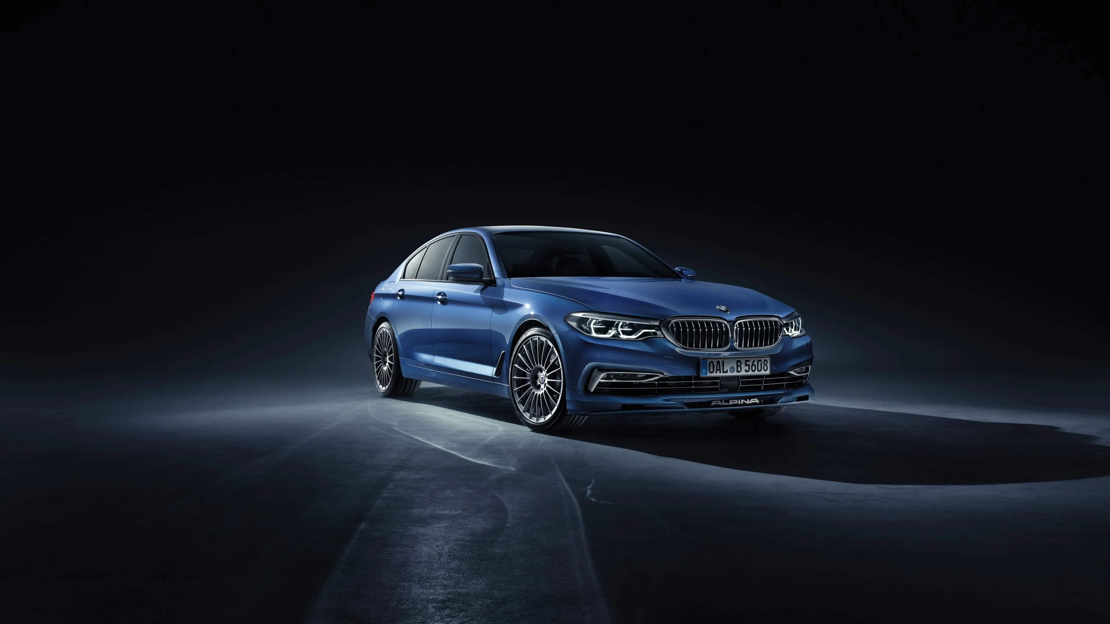 Blue Bmw Shown in Studio Light with Reflective Floor