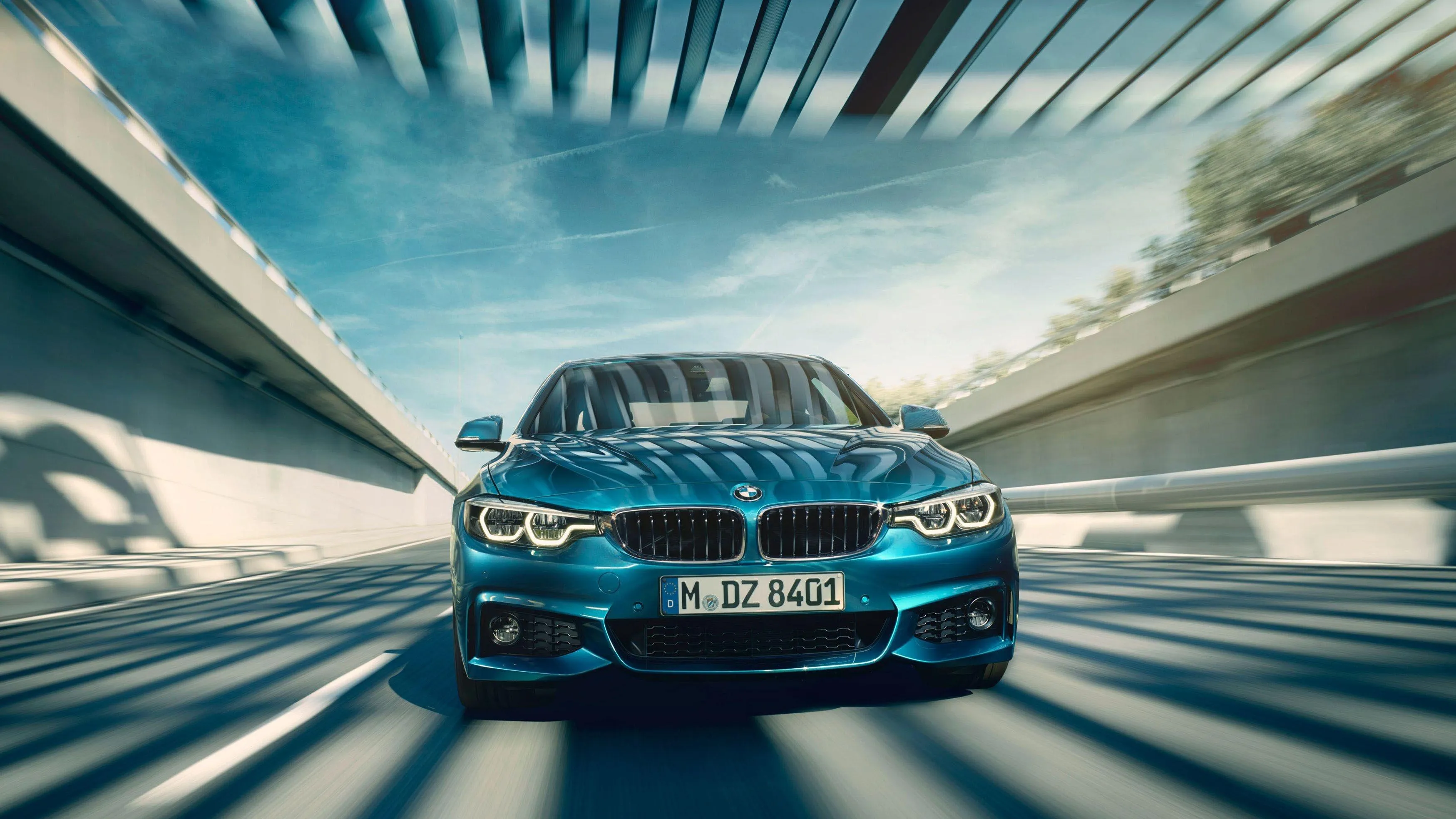 Blue Bmw Speeding Through Futuristic Tunnel with Motion Blur