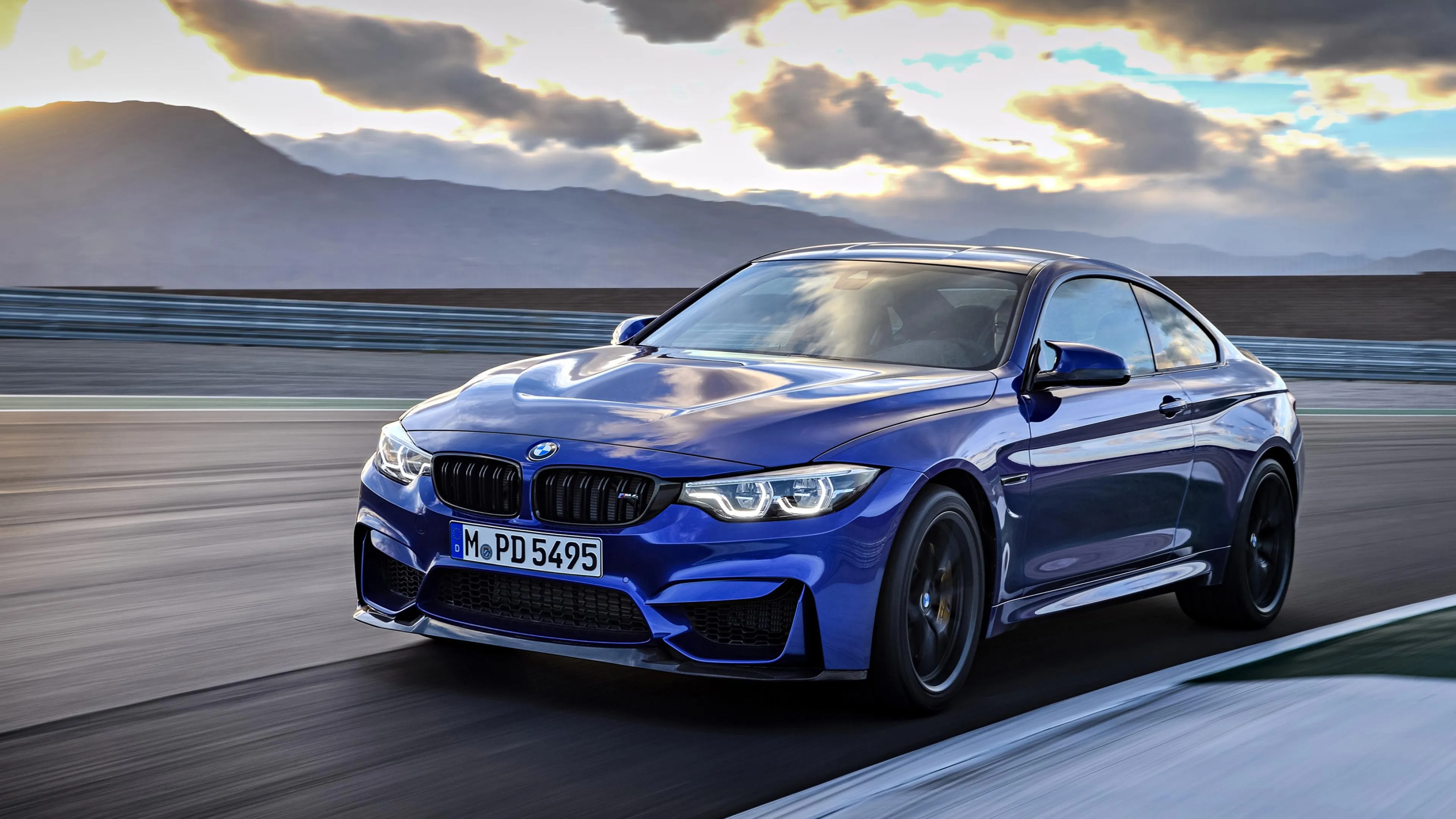 Blue Bmw Sports Car Driving on a Race Track Wallpaper